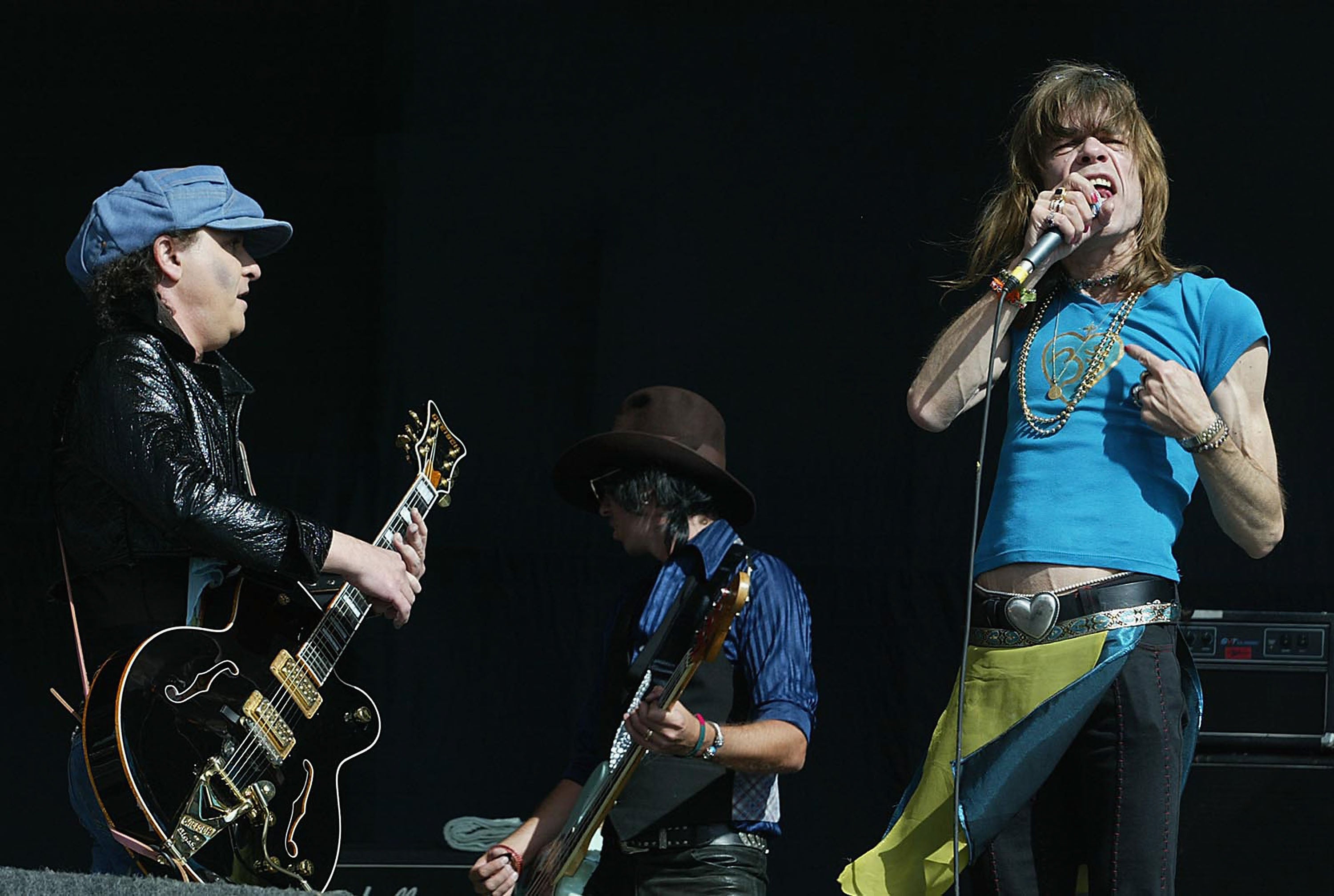 David Johansen (right) on stage with Sylvain Sylvain and Sami Yaffa of The New York Dolls at Reading Festival in 2004