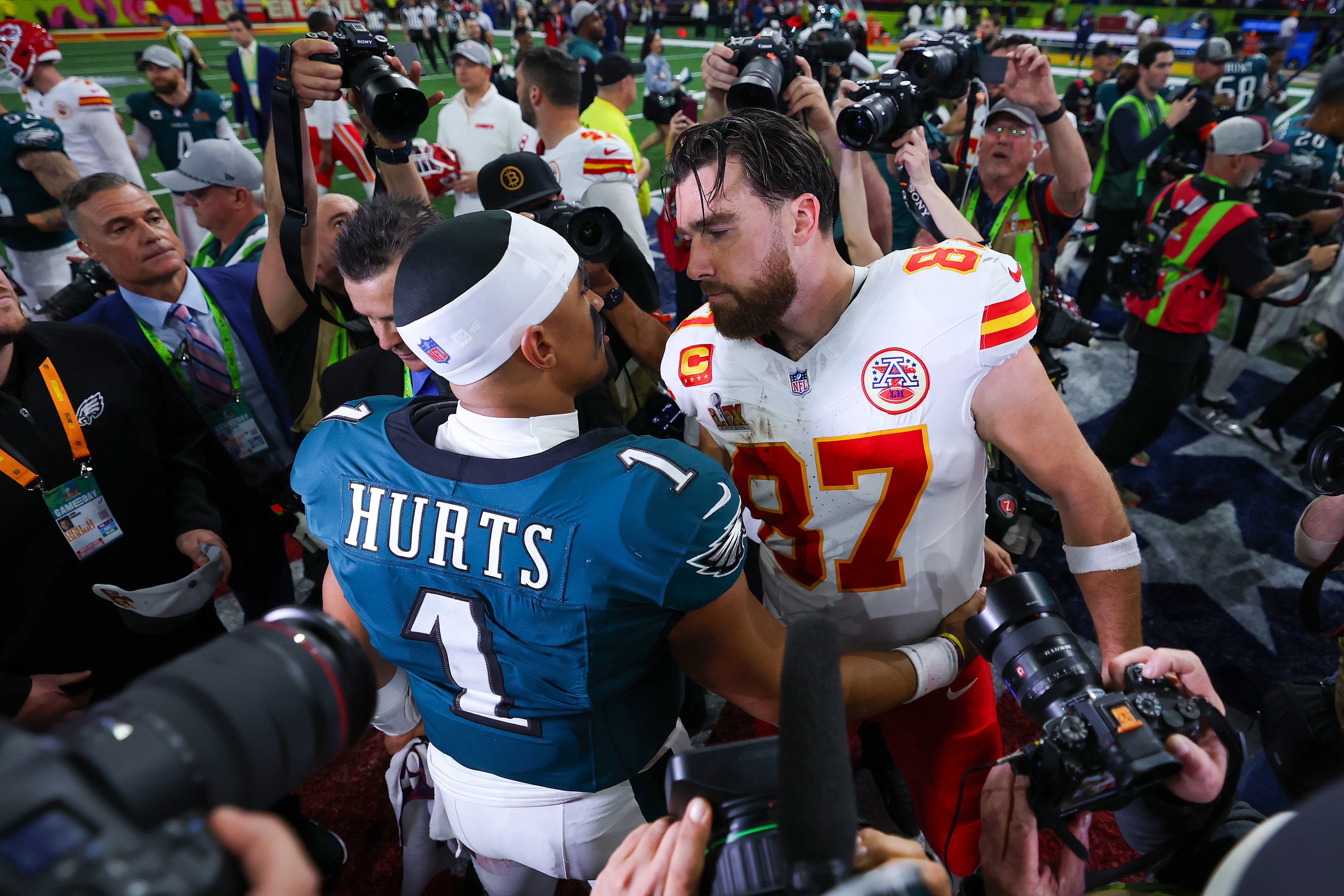 Jalen Hurts (left) and Travis Kelce meet after the Philadelphia Eagles beat Kansas City Chiefs at Caesars Superdome on February 9