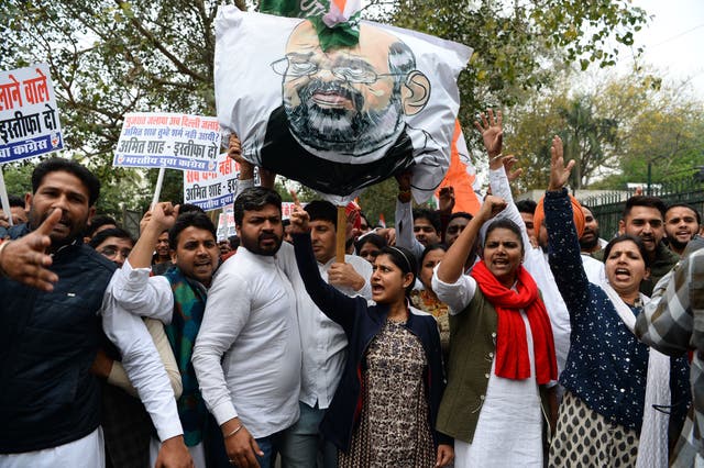 <p>File. Indian Youth Congress activists shout slogans next to an effigy of home minister Amit Shah during a protest demanding his resignation for the hate speeches over sectarian riots in India’s capital, near the Parliament in New Delhi on 2 March 2020</p>