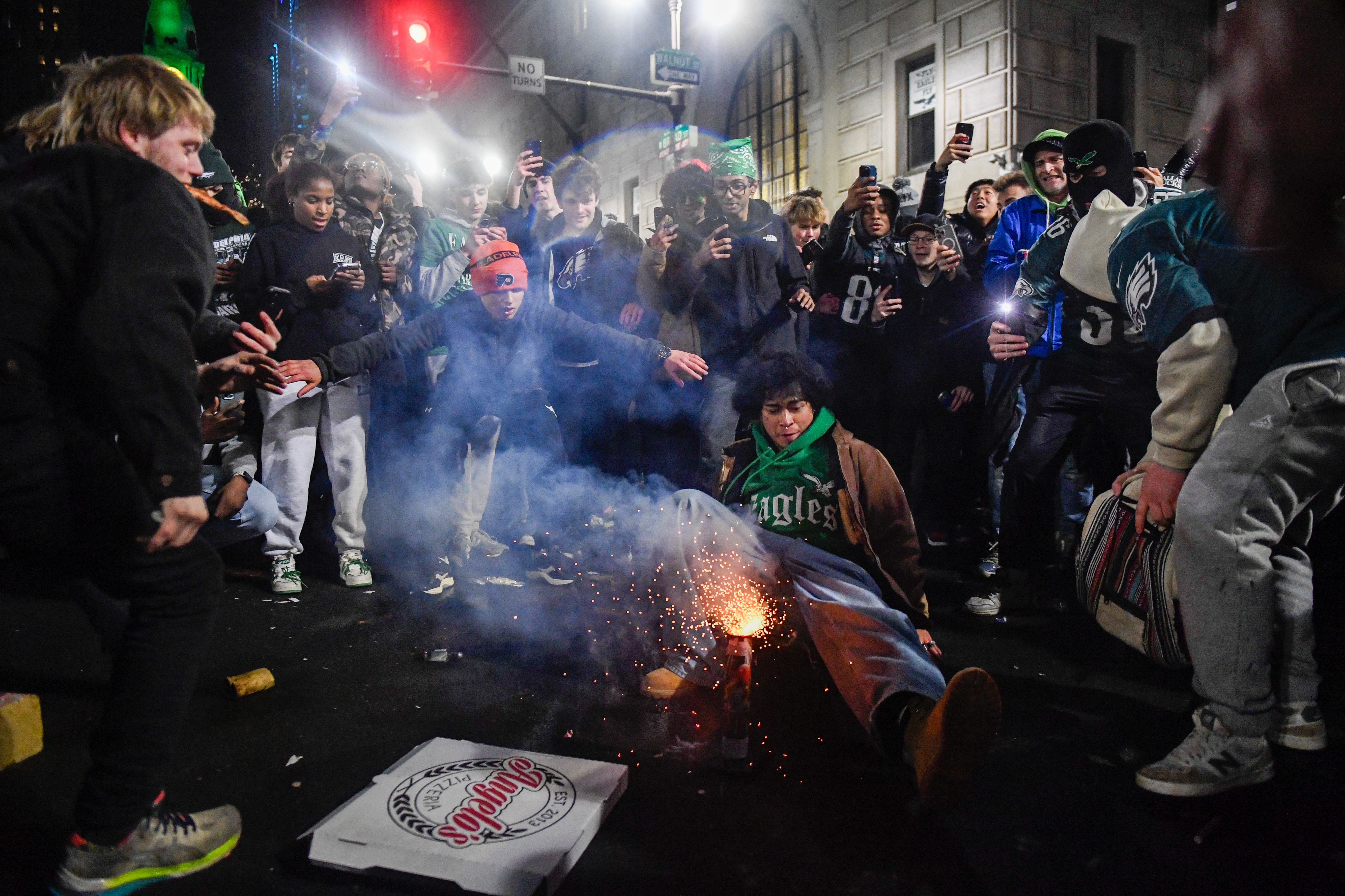 Fans wearing Philadelphia Eagles dangerously ignite fireworks within densely crowded areas on Sunday