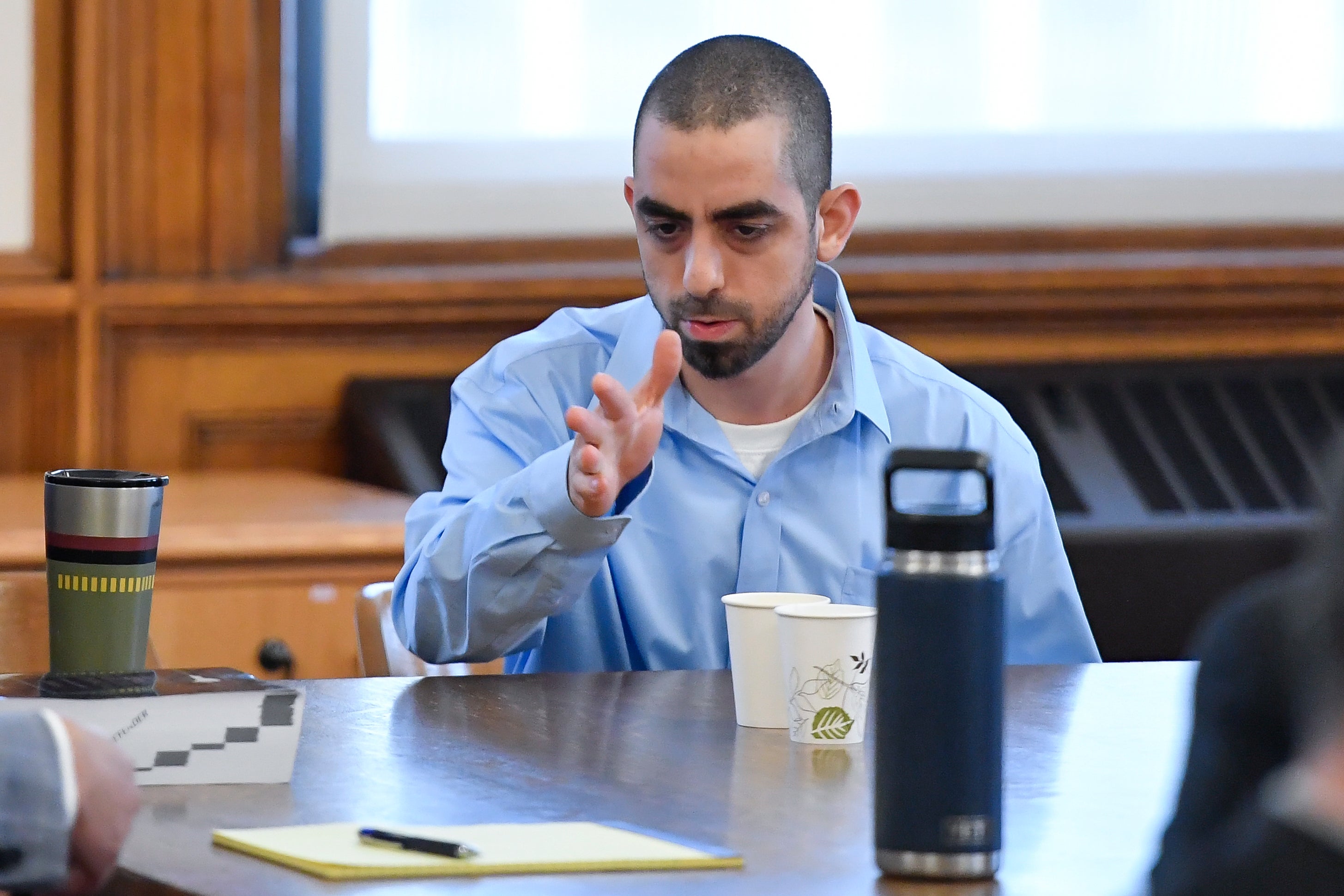 <p>Hadi Matar, charged with severely injuring author Salman Rushdie in a 2022 knife attack, speaks to his defense team in Chautauqua County court in Mayville, N.Y., Monday, Feb. 10, 2025</p>