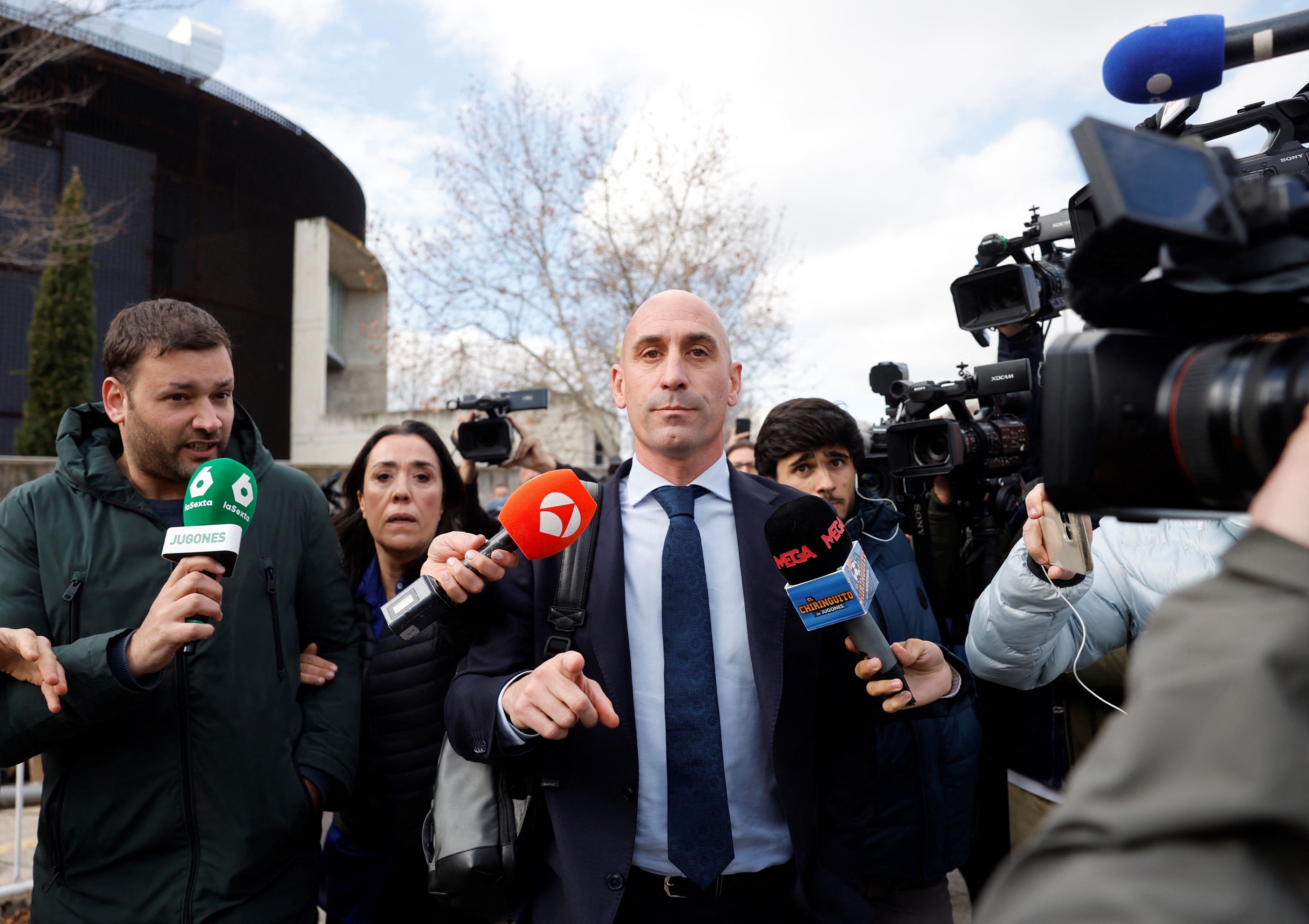 Luis Rubiales reacts to the media as he leaves after taking the stand during his trial