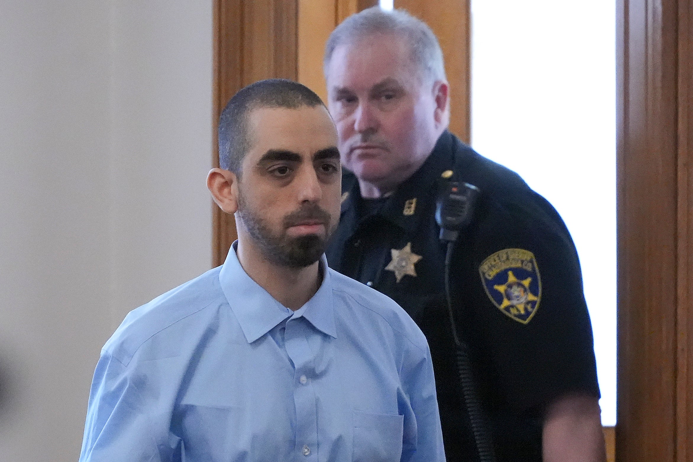 Hadi Matar is escorted into the courtroom at the Chautauqua County Courthouse on Tuesday