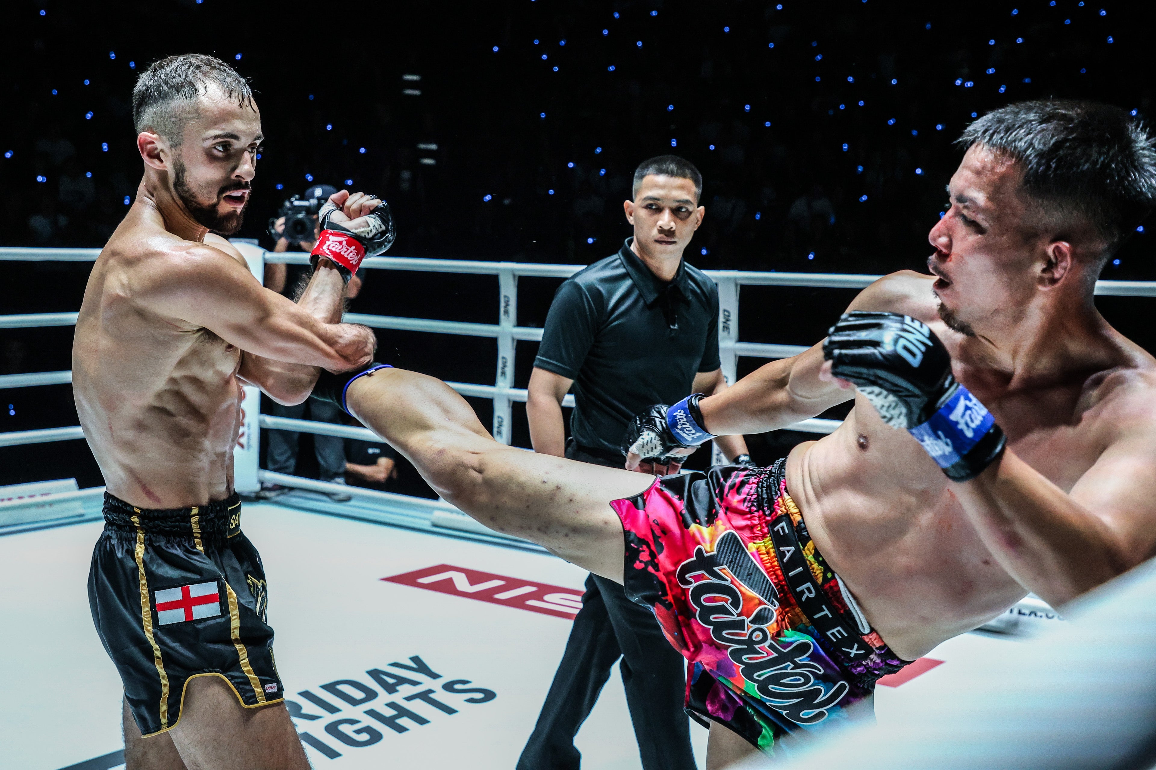 Jake Peacock (left) in action at a ONE Championship event