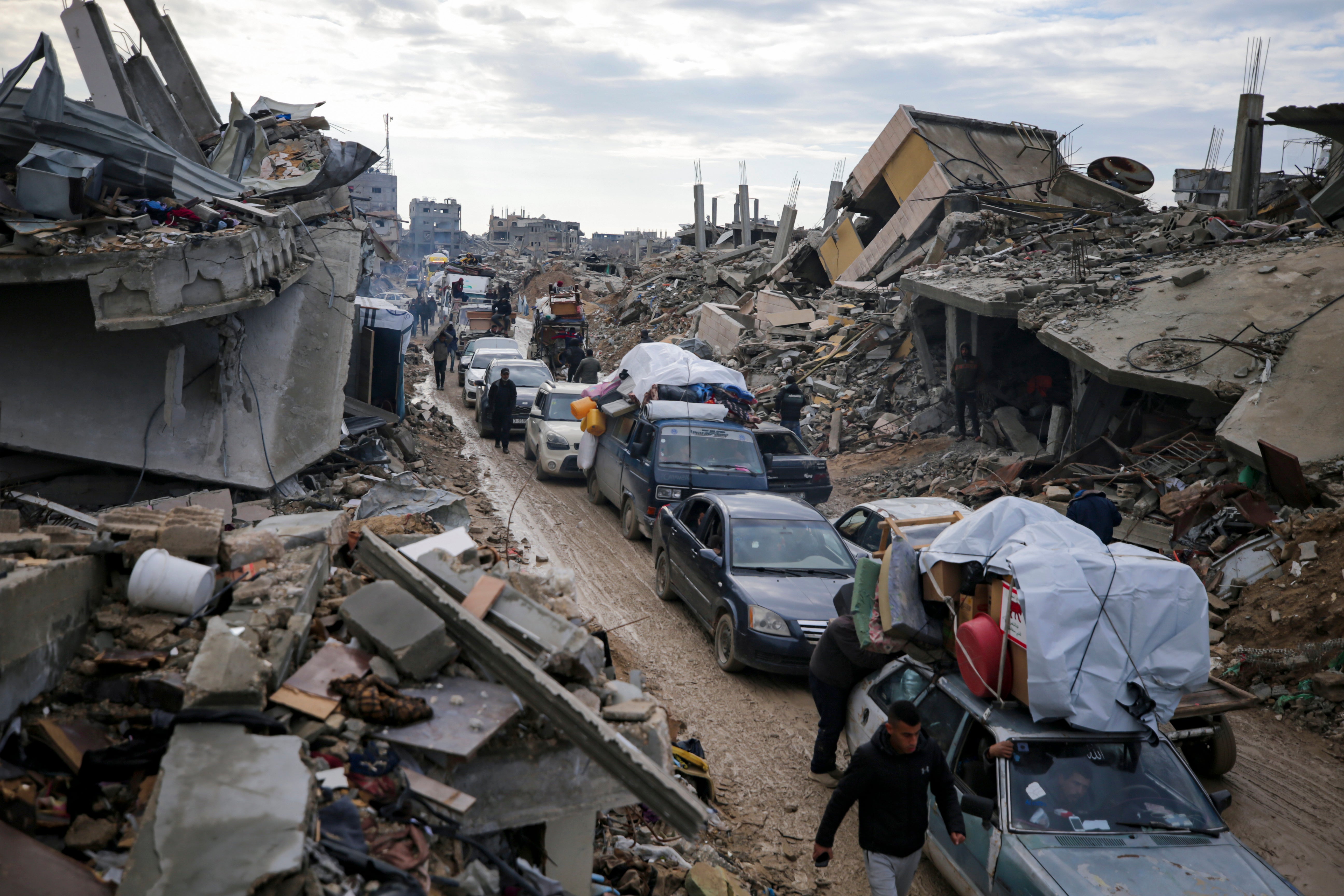 Displaced Palestinians make their way from central Gaza to their homes in the northern Gaza