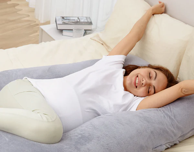 Soothe pregnancy aches and rest easy with the Momcozy U-Shaped Huggable pillow