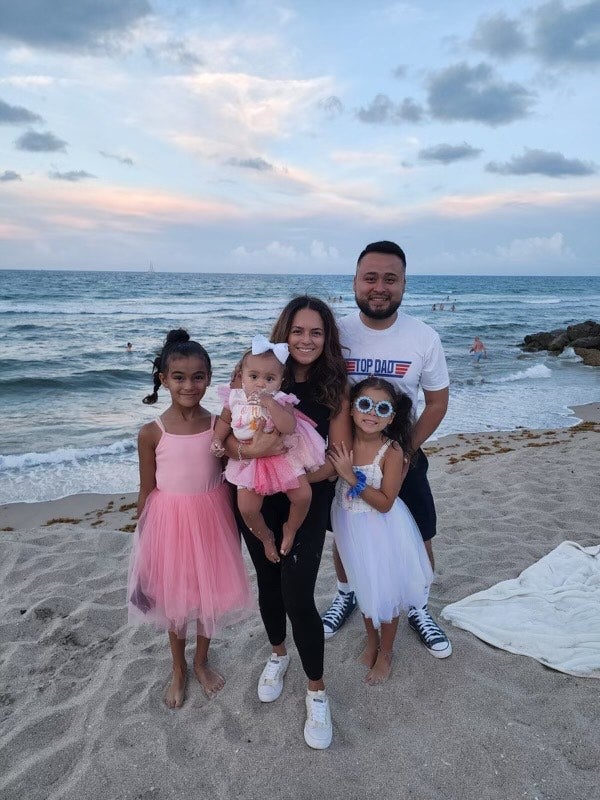 Quebec Vasquez with her husband George and their three daughters.