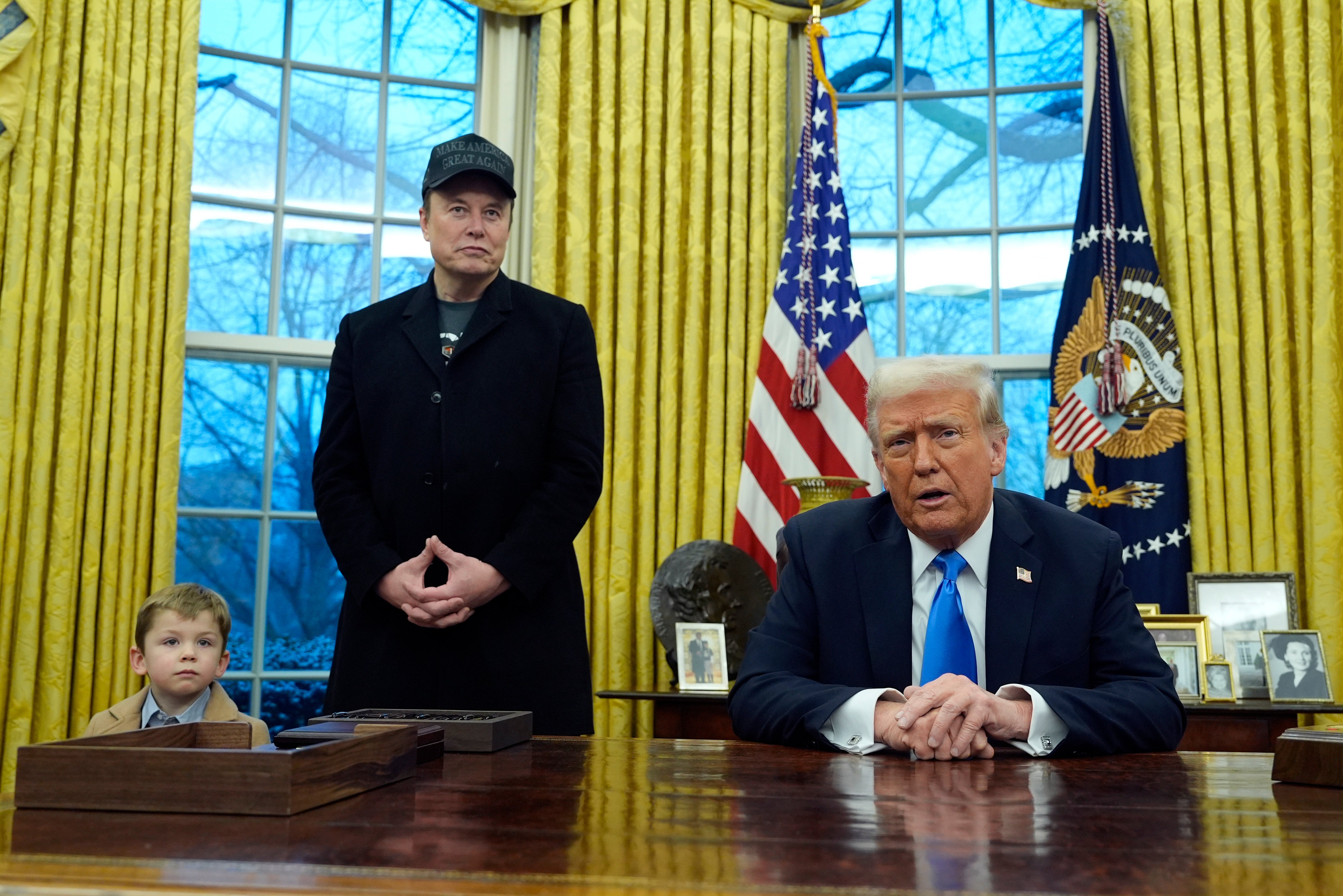 Donald Trump, pictured in the Oval Office on February 11, pledged to buy a brand-new Tesla on Tuesday morning as Elong Musk faces backlash over his political influence