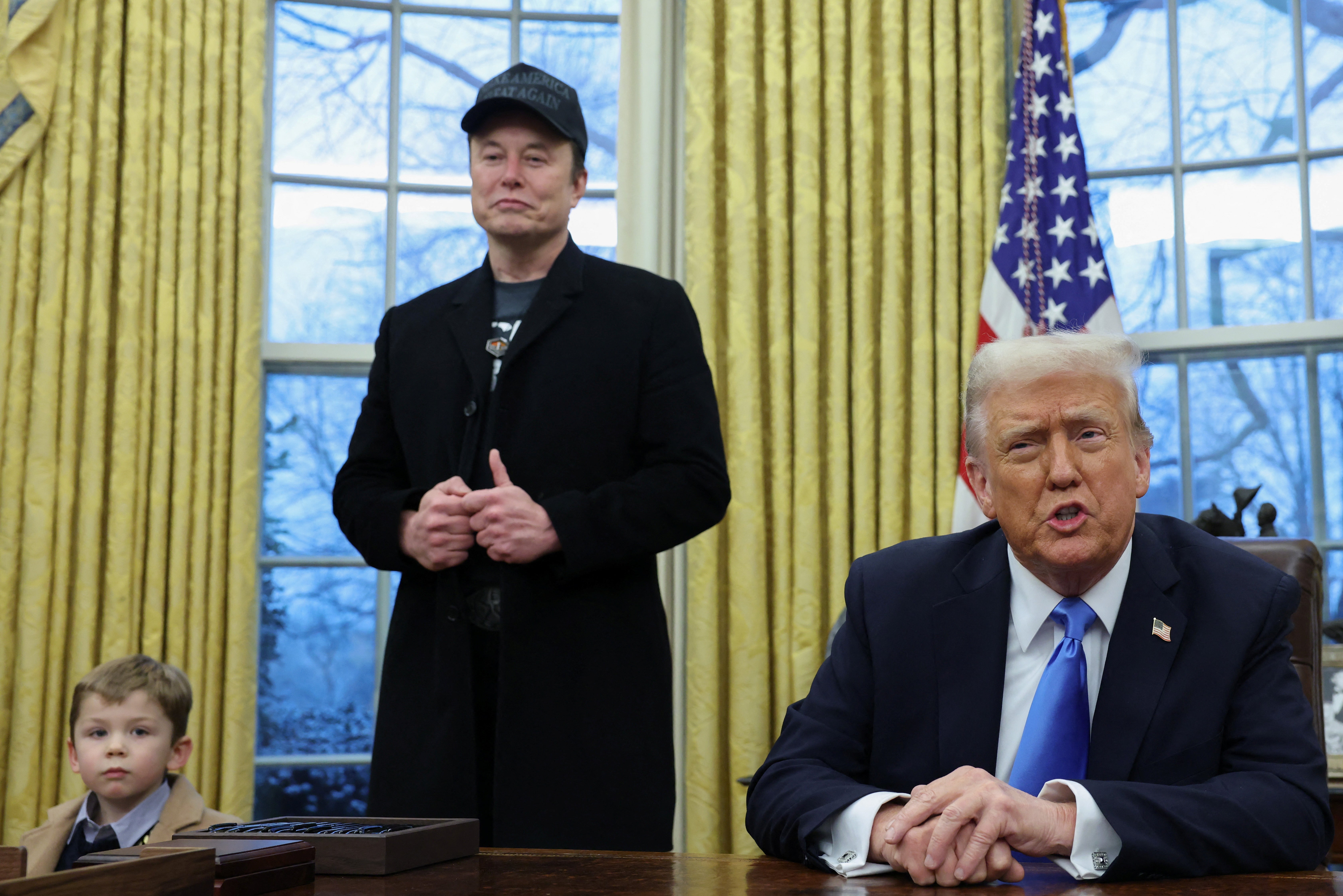 Elon Musk appears in the Oval Office with Donald Trump on February 11