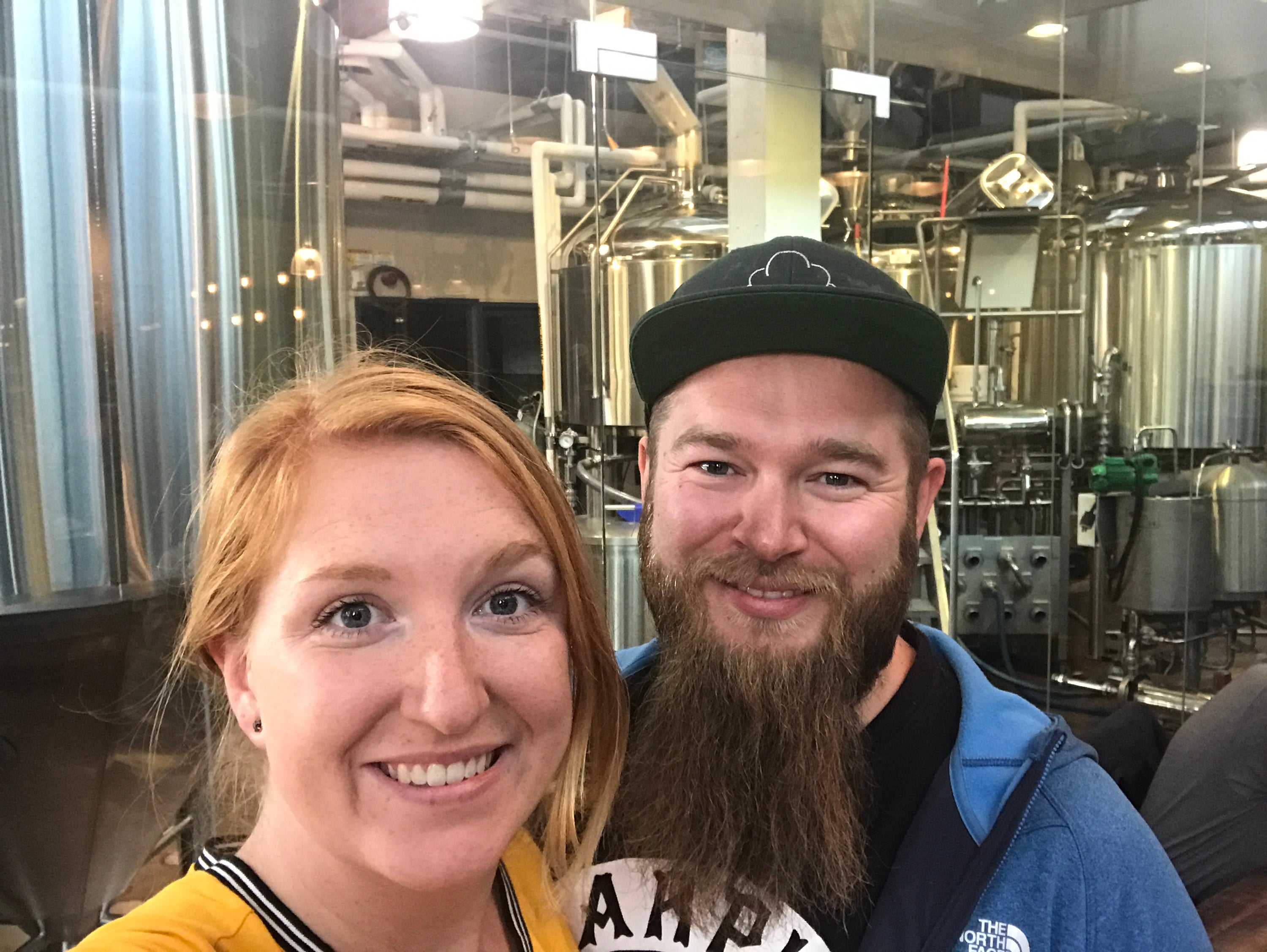 The couple touring a brewery in Vancouver, Canada