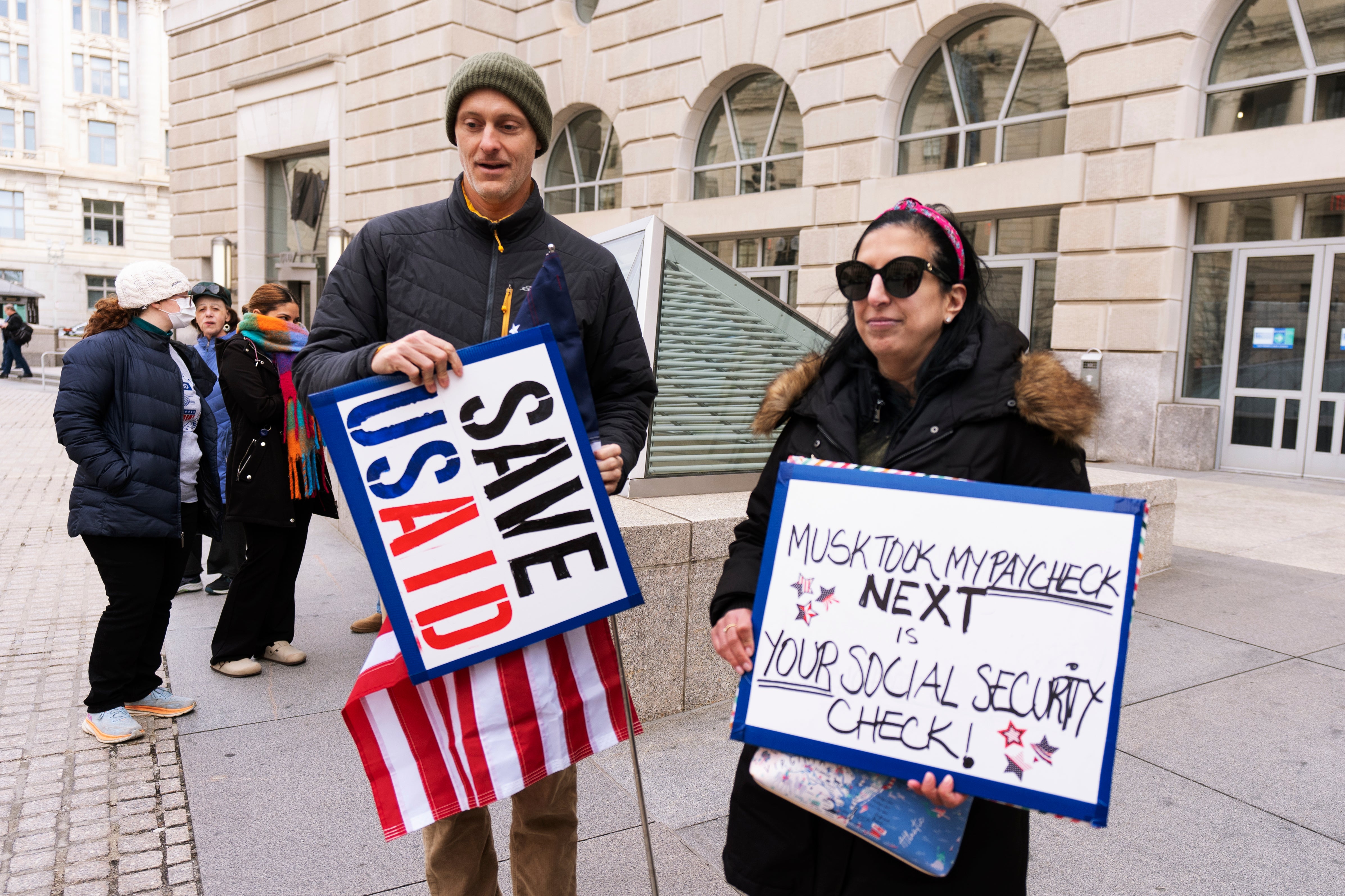 USAID workers protesting job cuts in Washington, DC on February 10; as over 10,000 people in the US and 50,000 people worldwide are expected to lose their jobs