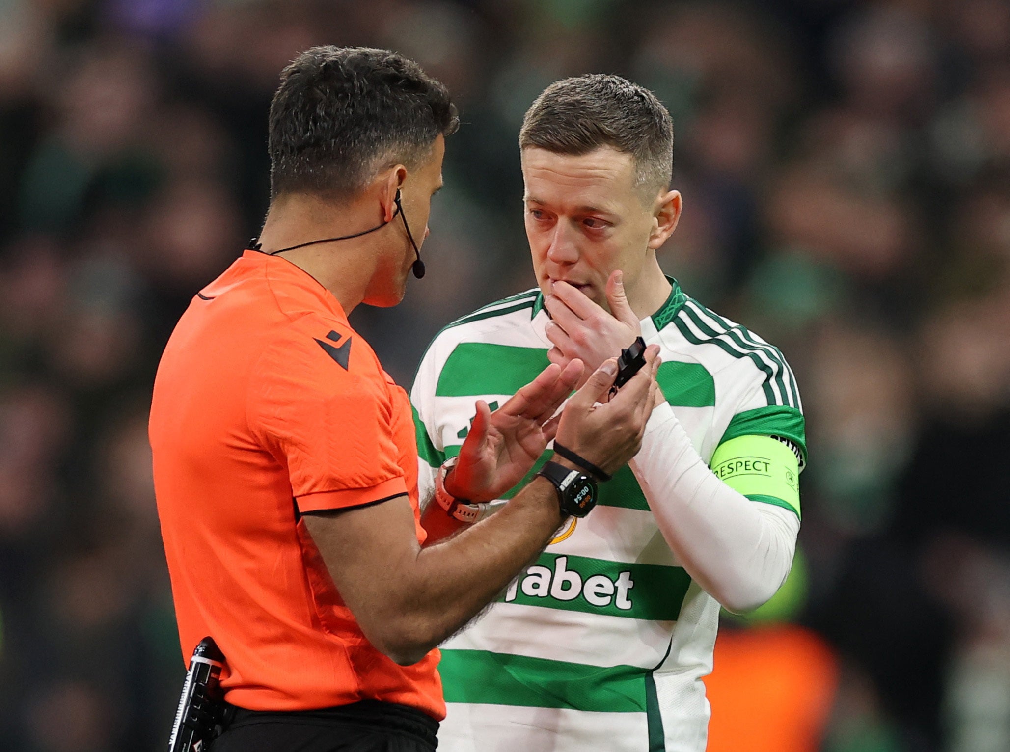 Celtic's Callum McGregor speaks with referee Jesus Gil Manzano after Kuhn's goal is disallowed