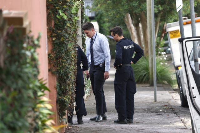 <p>File. Detectives inspect area where anti-Israel graffiti was written on a wall in the Sydney suburb of Woollahra in December 2024</p>