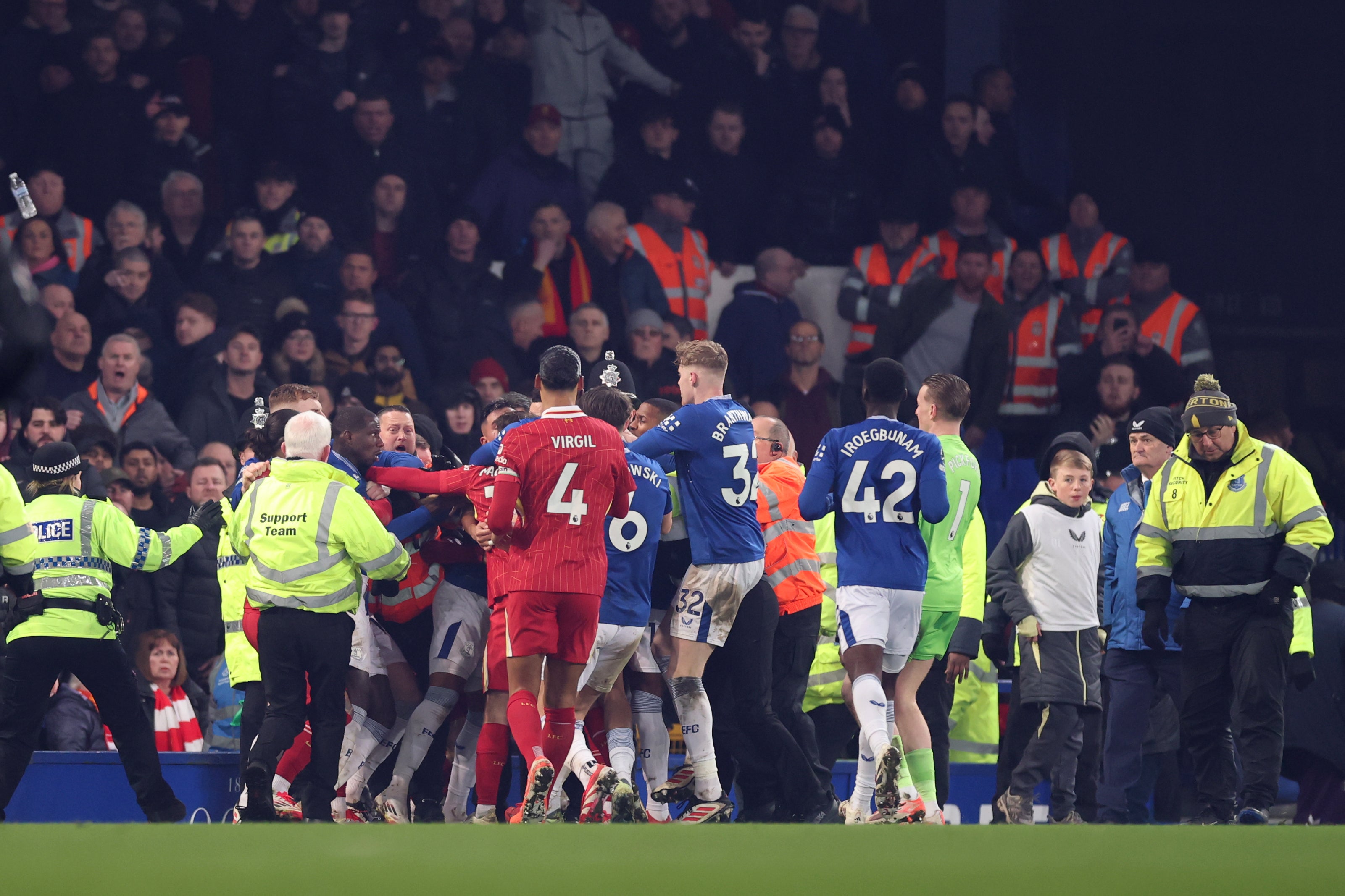 Everton and Liverpool players clash at the end of the Merseyside derby