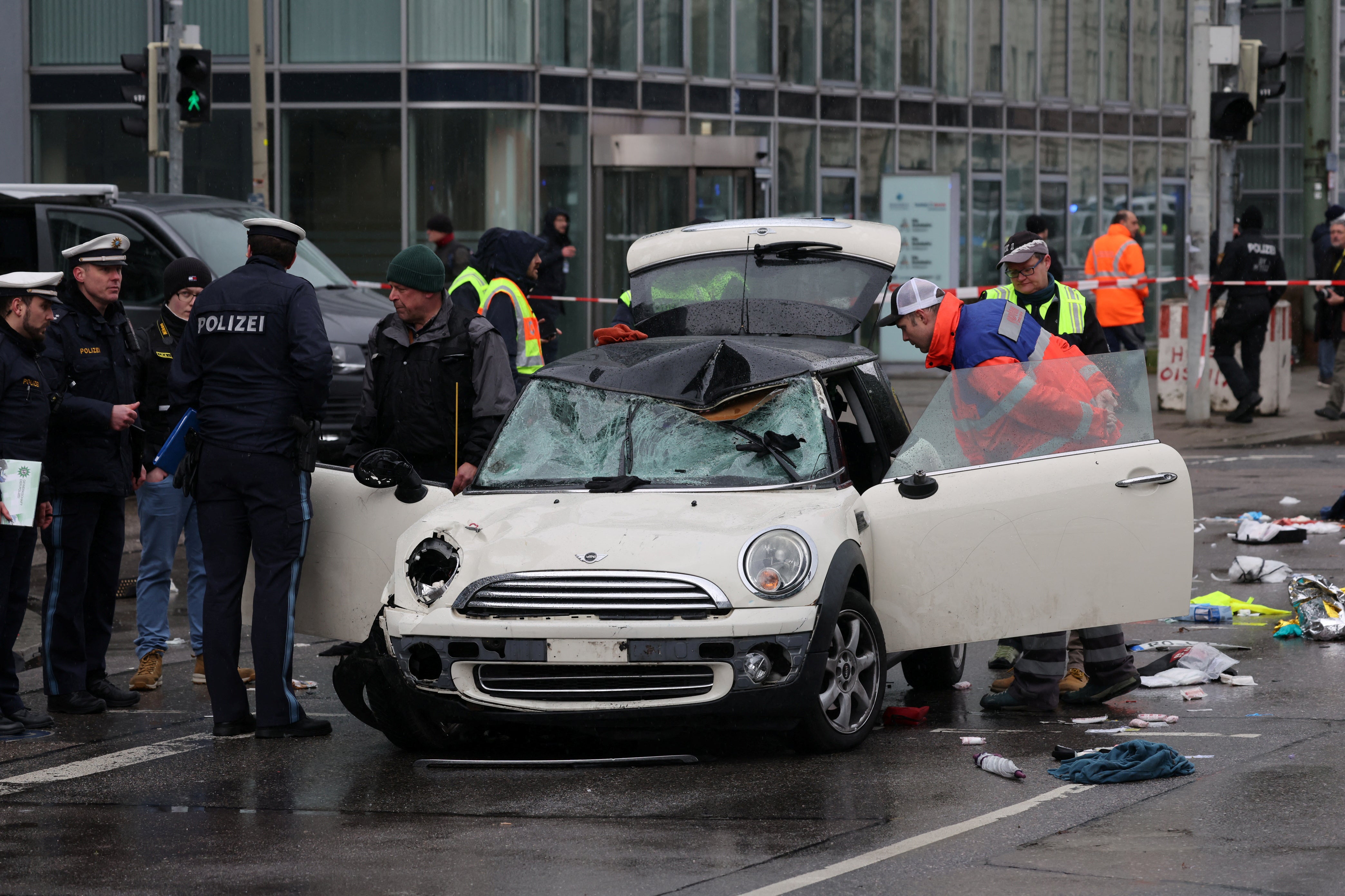 Police investigate the car at the centre of the incident