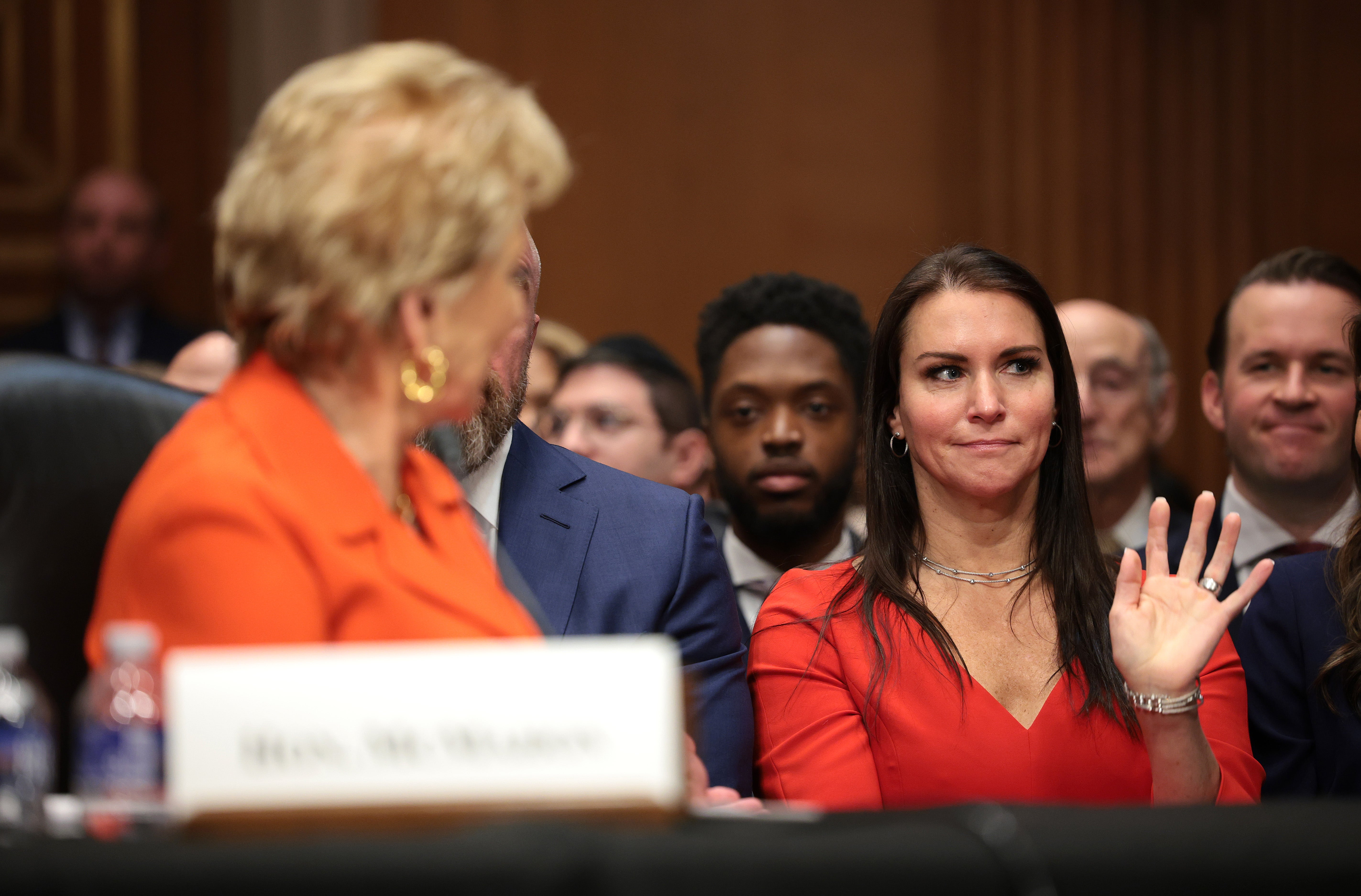 In her opening remarks, McMahon introduced senators to her children, Shane and Stephanie McMahon (right)