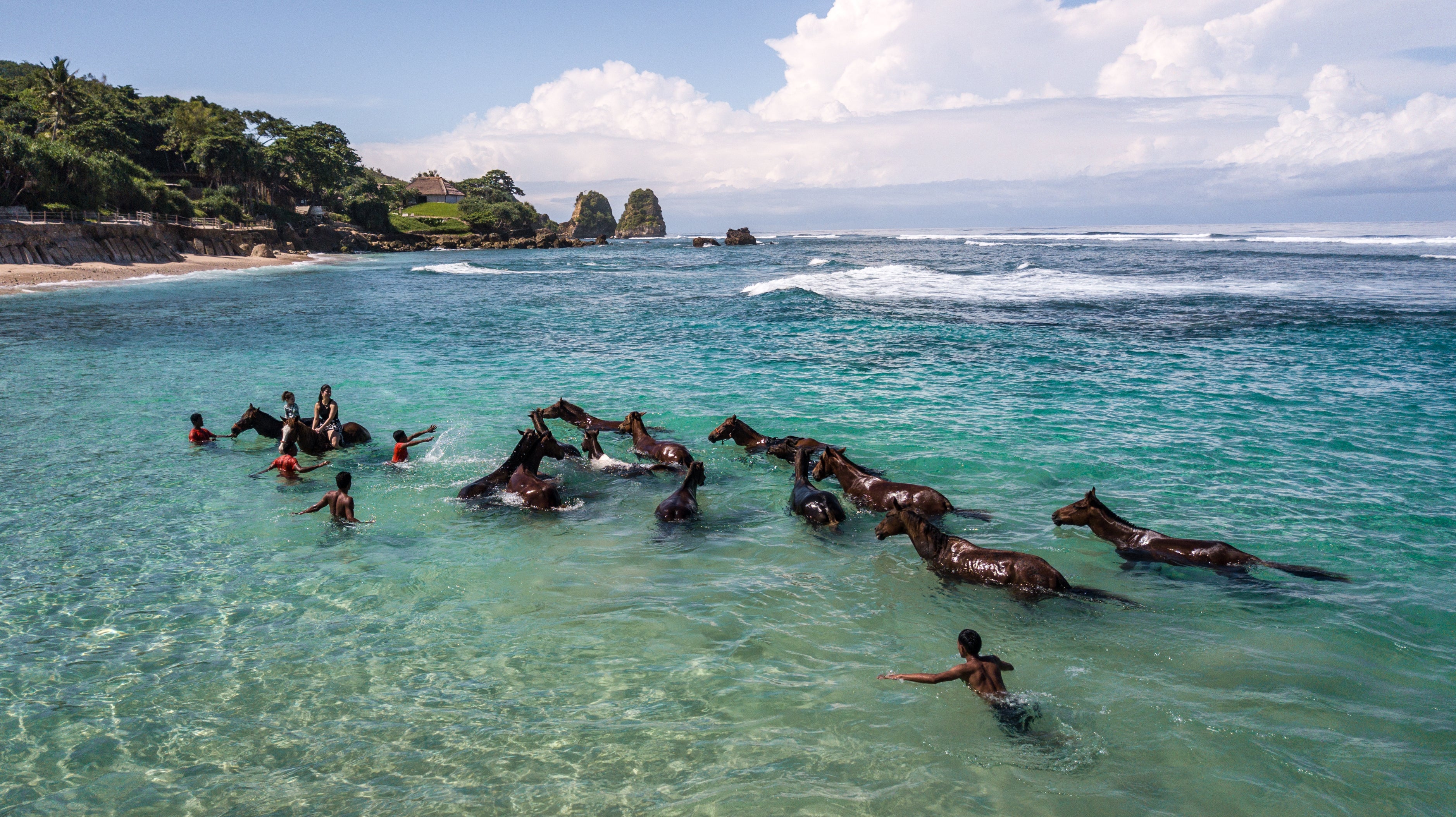 Swimming with horses at Nihi Sumba