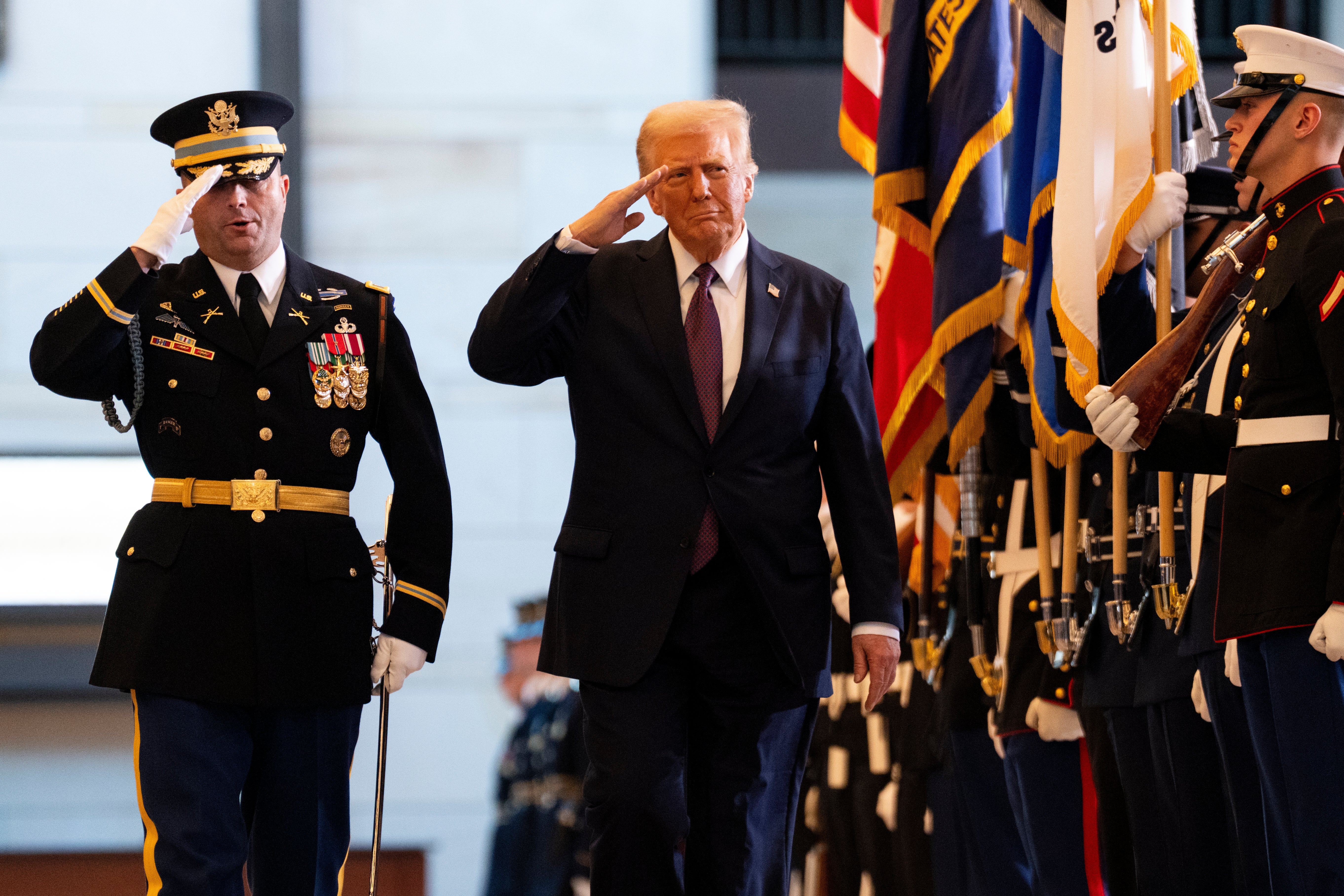 President Donald Trump reviews the troops in Emancipation Hall of the U.S. Capitol during his Inauguration ceremony. He has dismissed the members of the boards of visitors at four U.S. service academies