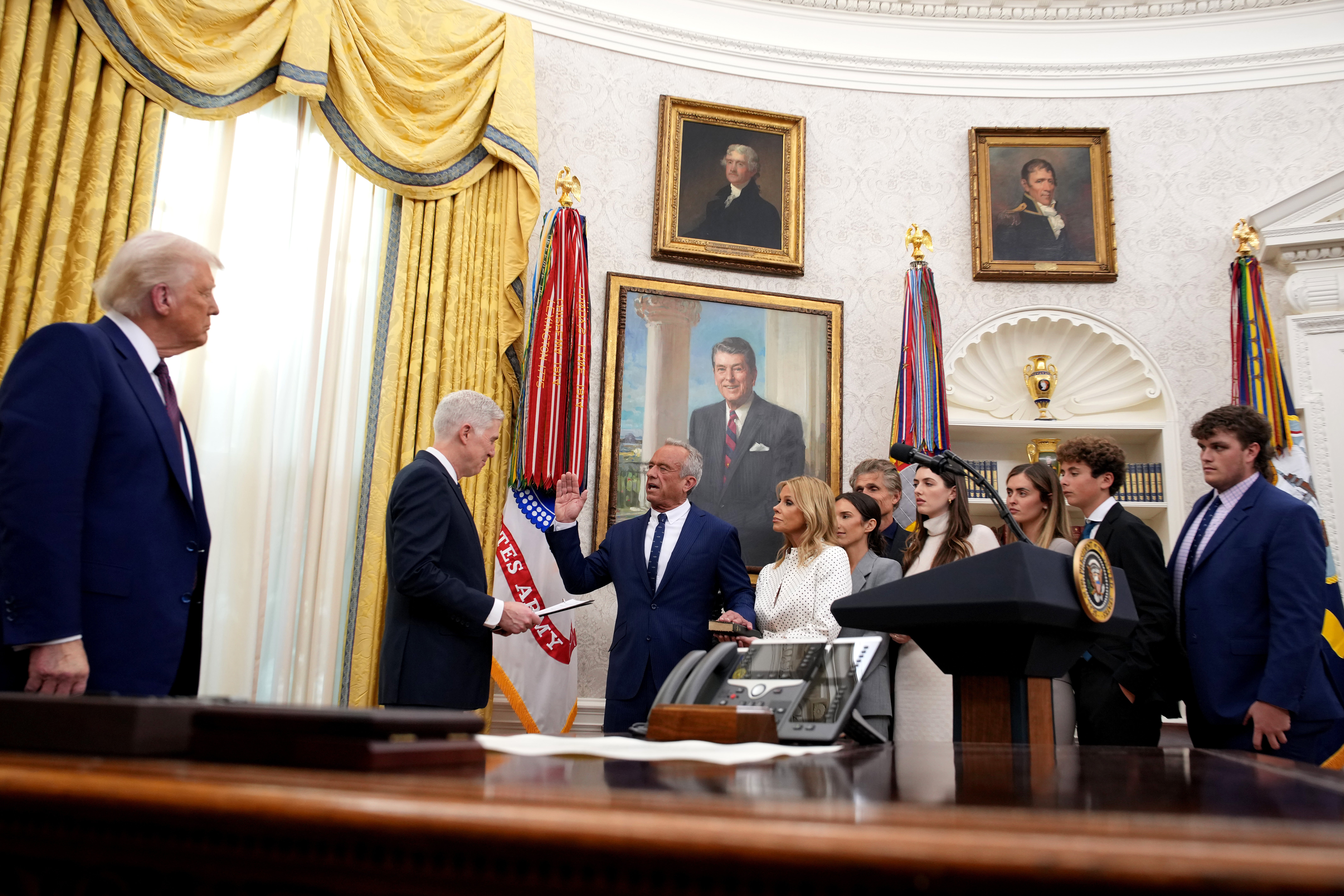 President Donald Trump watches on as Robert F. Kennedy Jr. is sworn in as Secretary of Health and Human Services