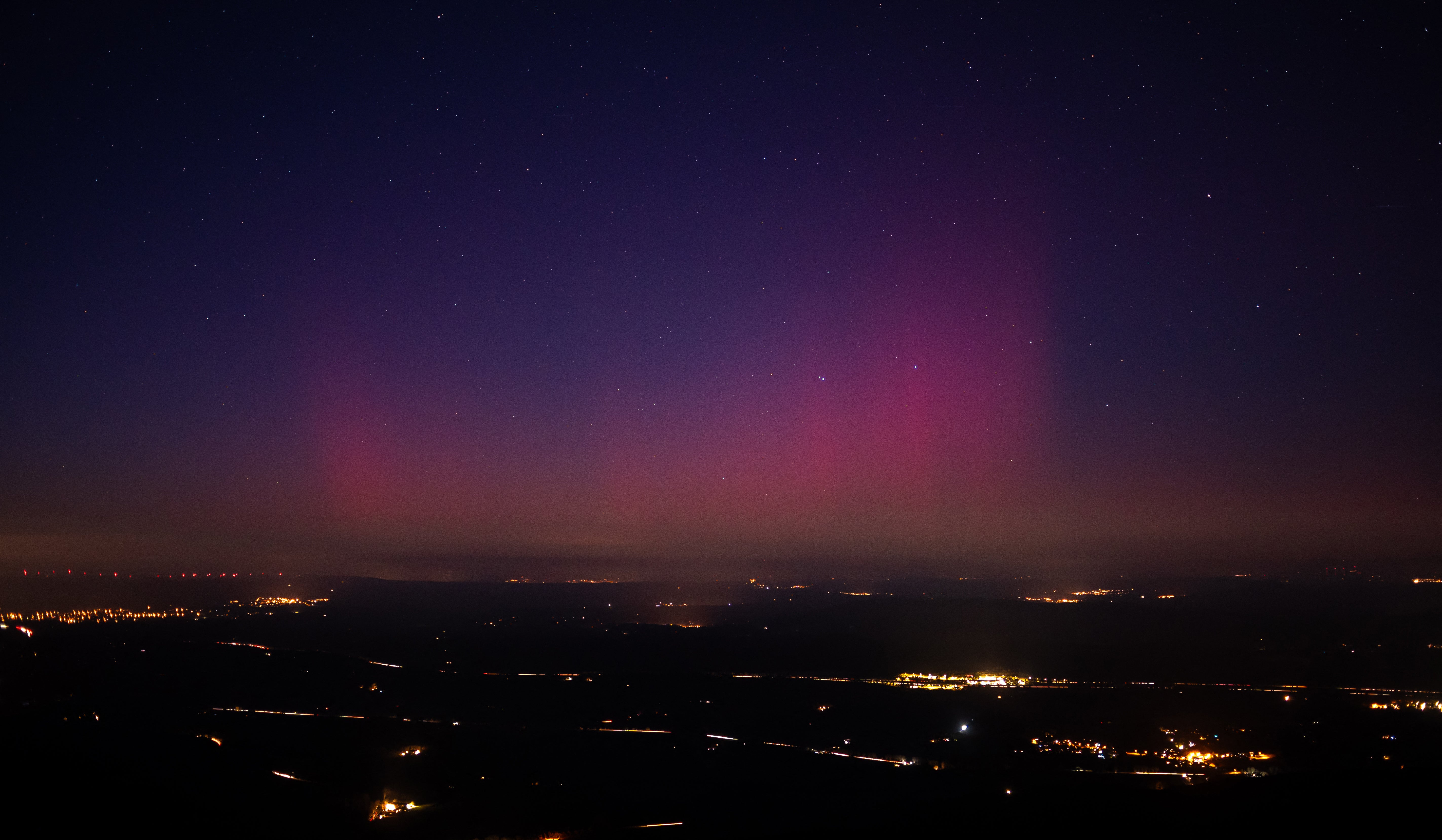 Picture taken from the southeastern France village of La Roquebrussanne shows aurora borealis early on 1 January 2025