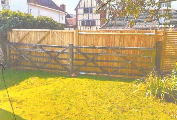 View from Barry and Sarah Dean's garden, showing the old five-bar fence access and the new higher fence and gate