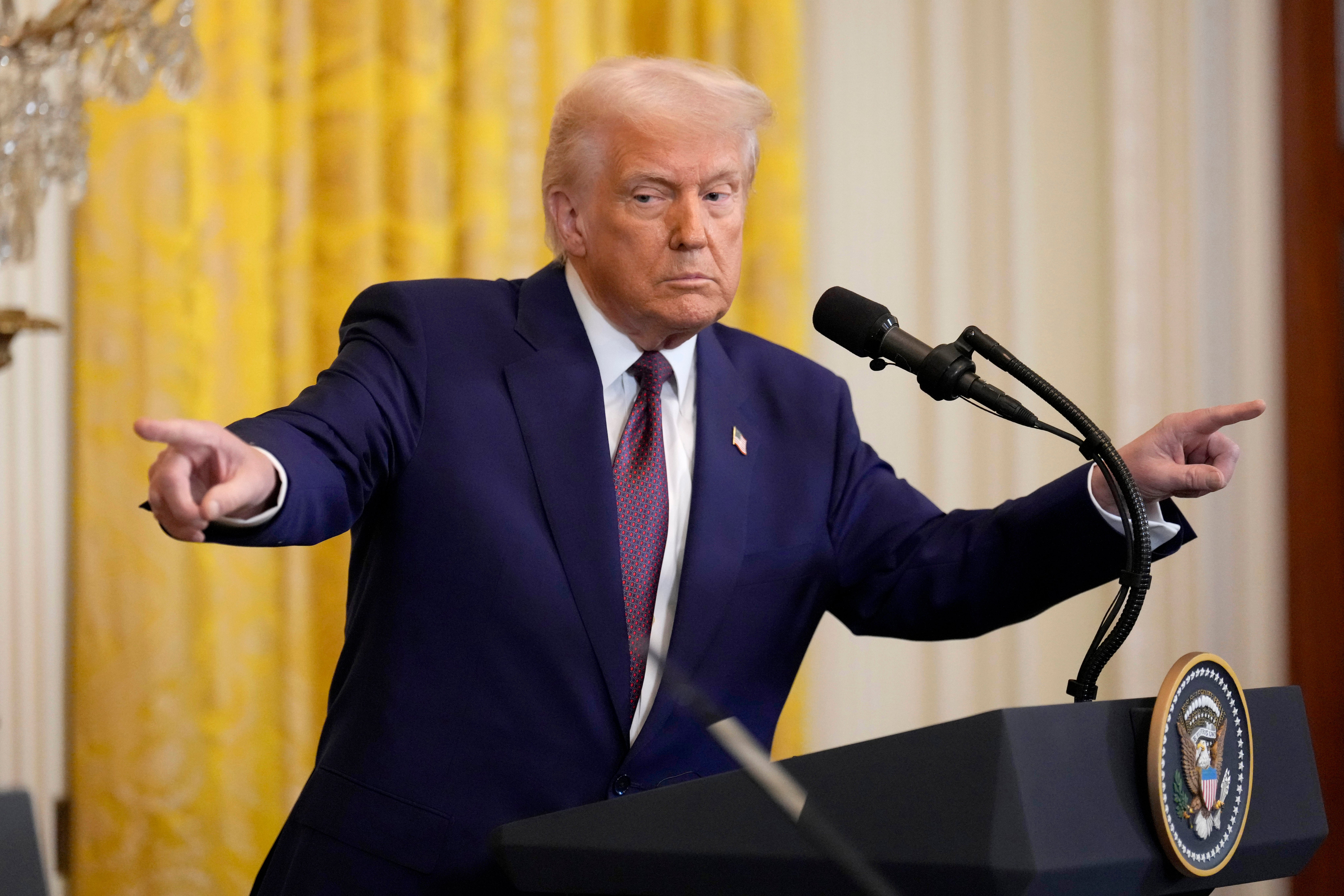 <p>Donald Trump points to a reporter during a news conference in the East Room of the White House, Thursday, 13 February 2025, in Washington</p>