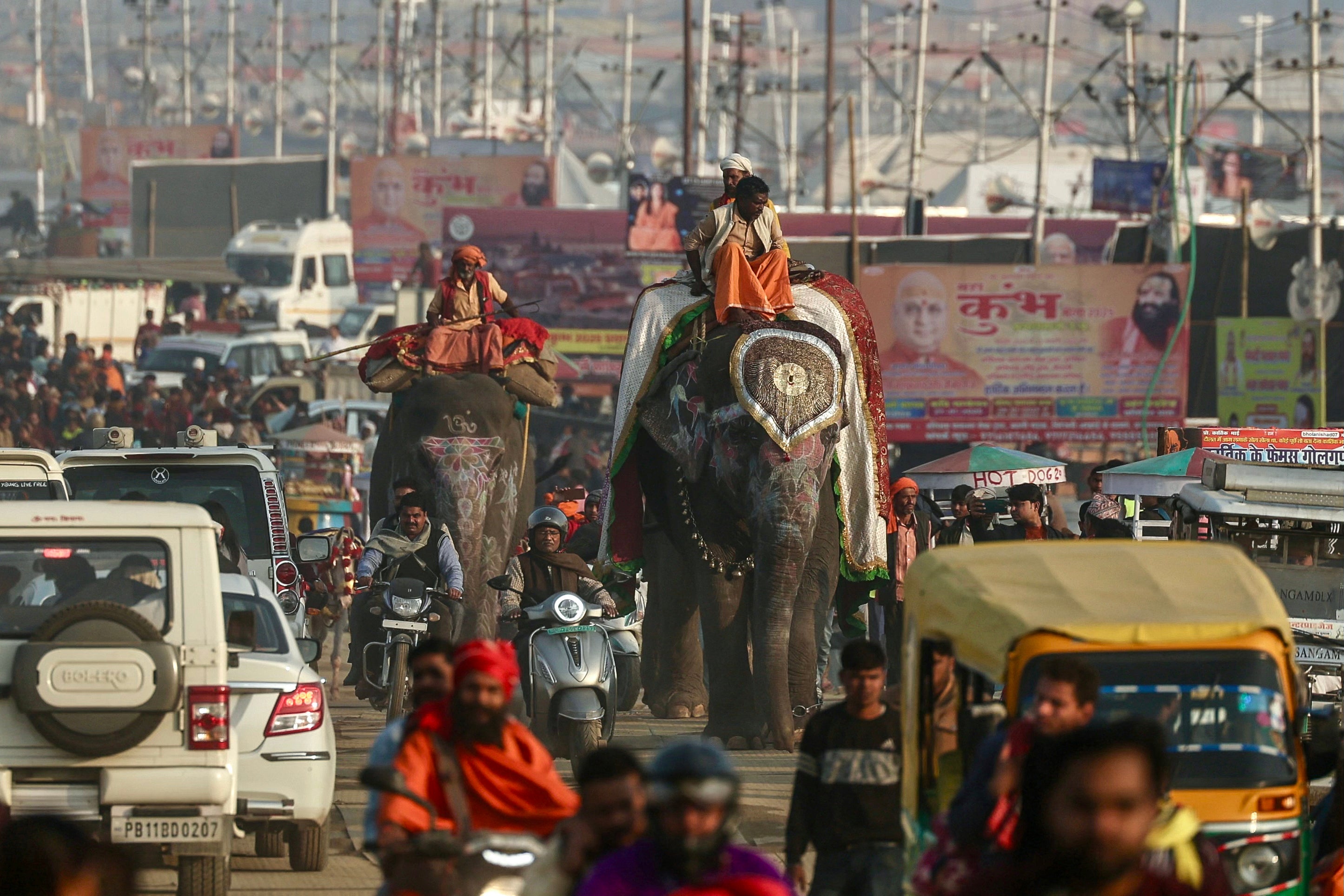 File. Mahouts ride elephants as they leave after a religious procession ahead of the Maha Kumbh Mela festival in Prayagraj on 11 January 2025