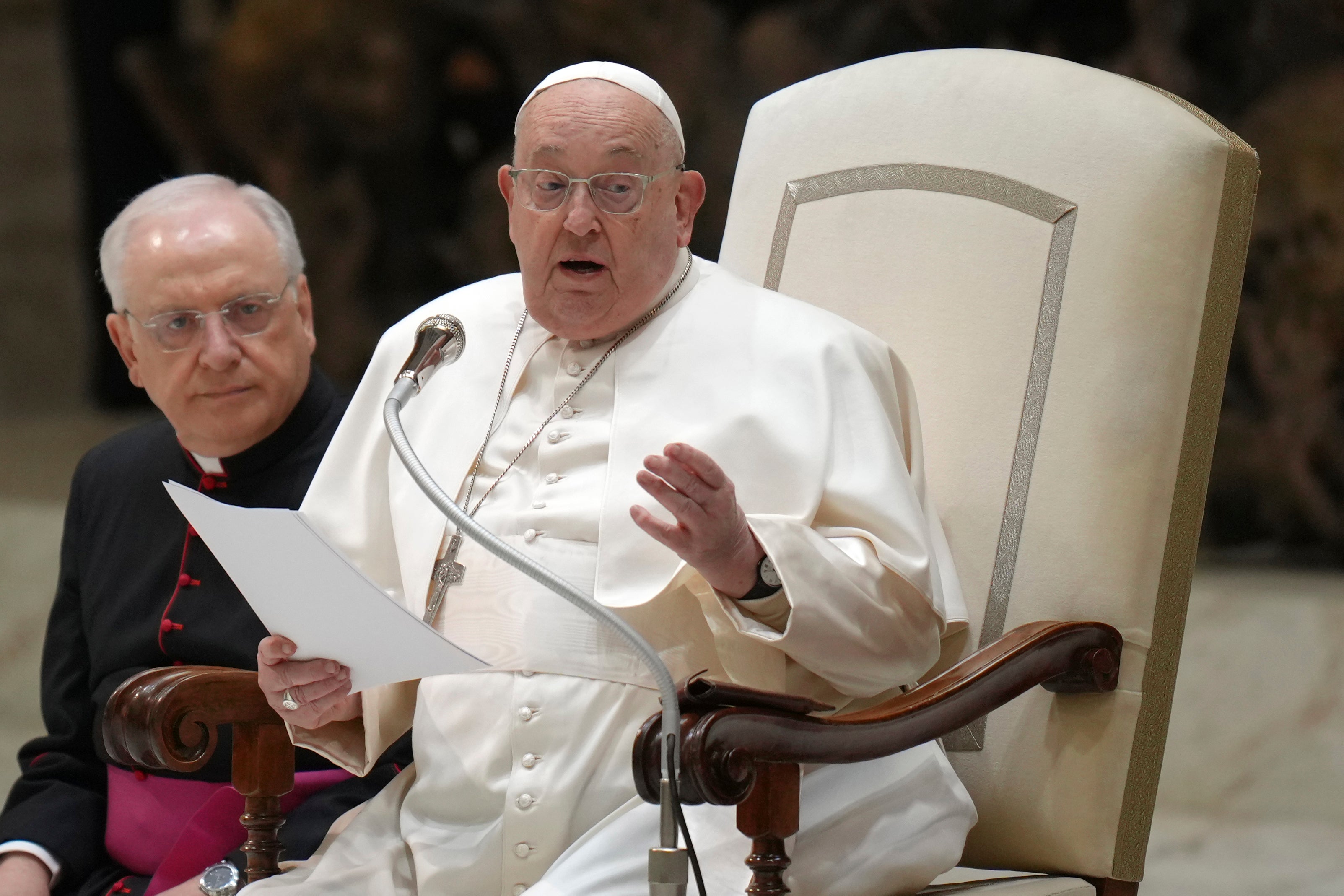 Pope Francis reads a speech during his weekly general audience, 12 February 2025