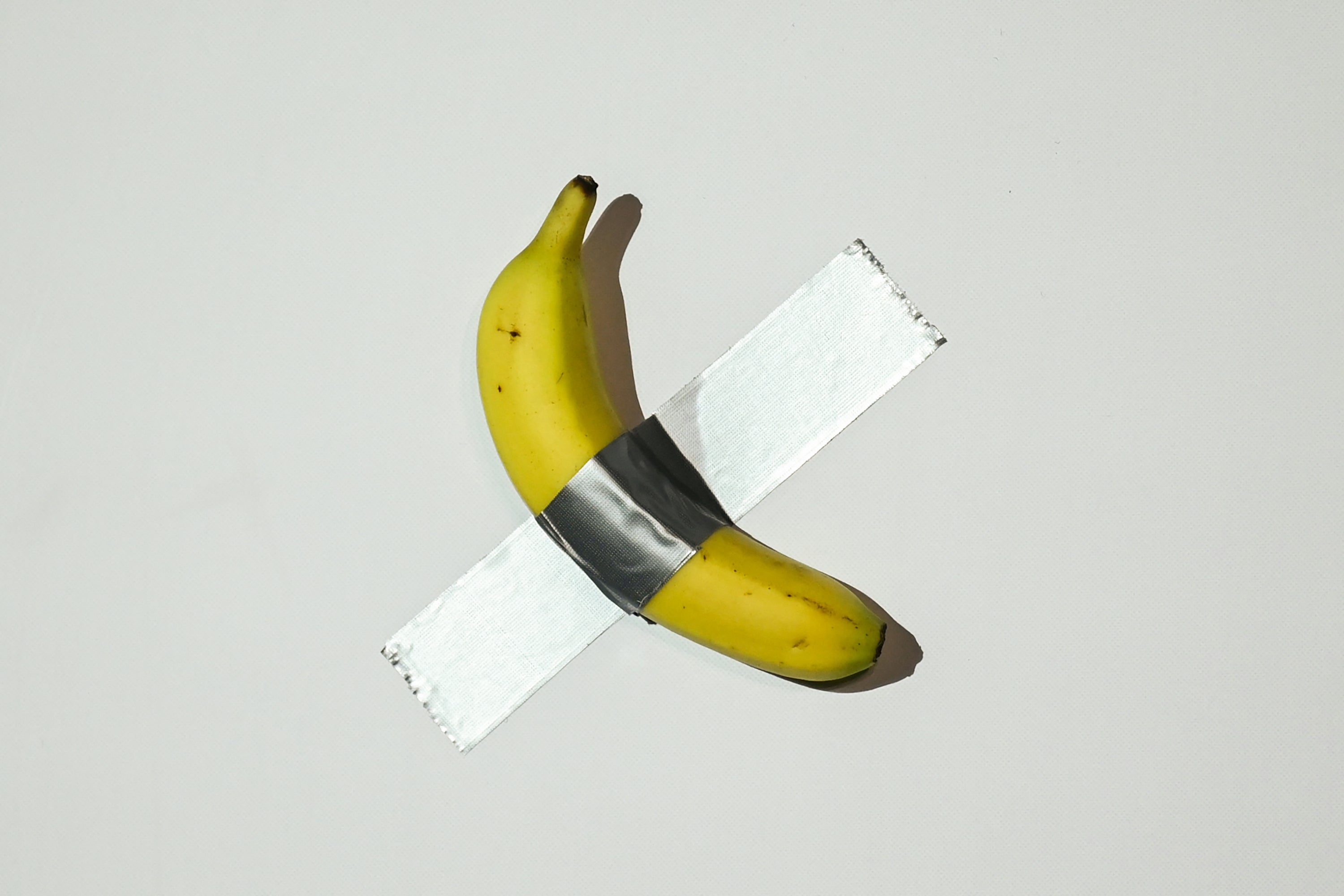 <p>File. A banana artwork composed of a fresh banana stuck to a wall with duct tape is seen before being eaten by Chinese-born crypto founder Justin Sun in Hong Kong on 29 November 2024, after buying the provocative work of conceptual art by Italian artist Maurizio Cattelan at New York auction for $6.2m</p>