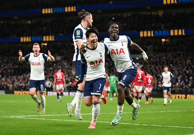 <p>Son Heung Min of Tottenham celebrates with teammates Radu Dragusin and Yves Bissouma against Man Utd</p>