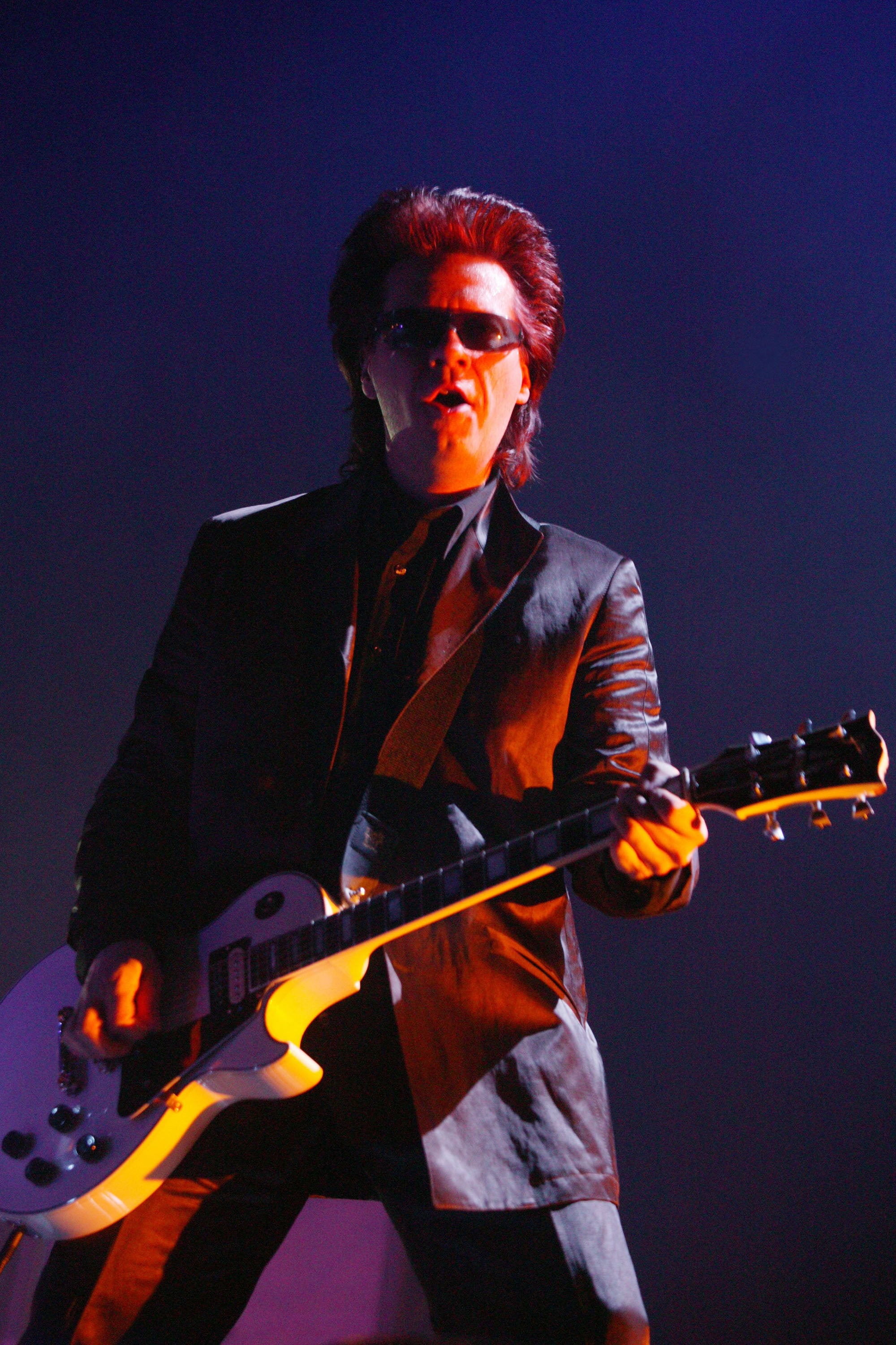 Duran Duran guitarist Andy Taylor performing in 2004