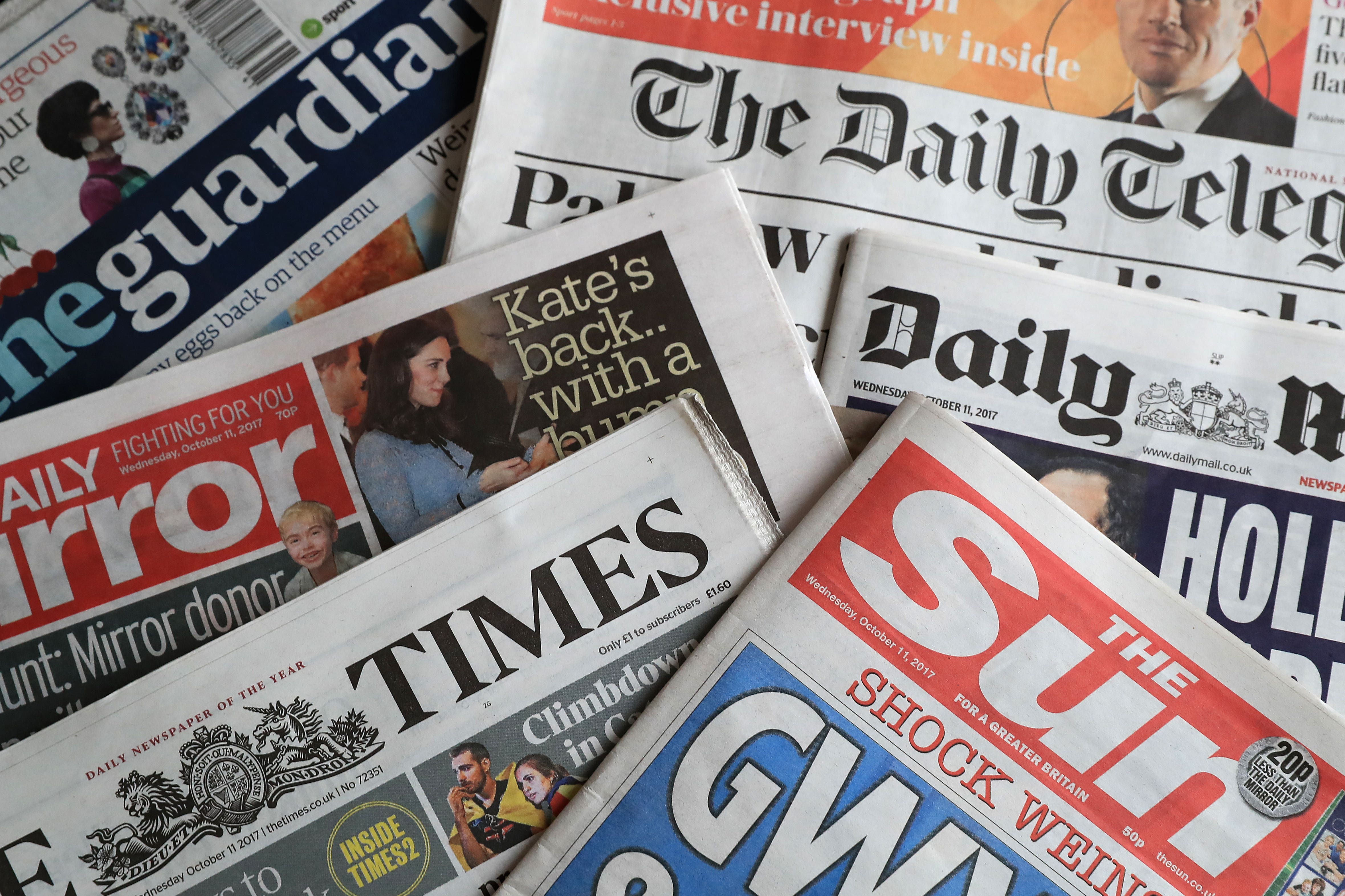 A collection of British newspapers.