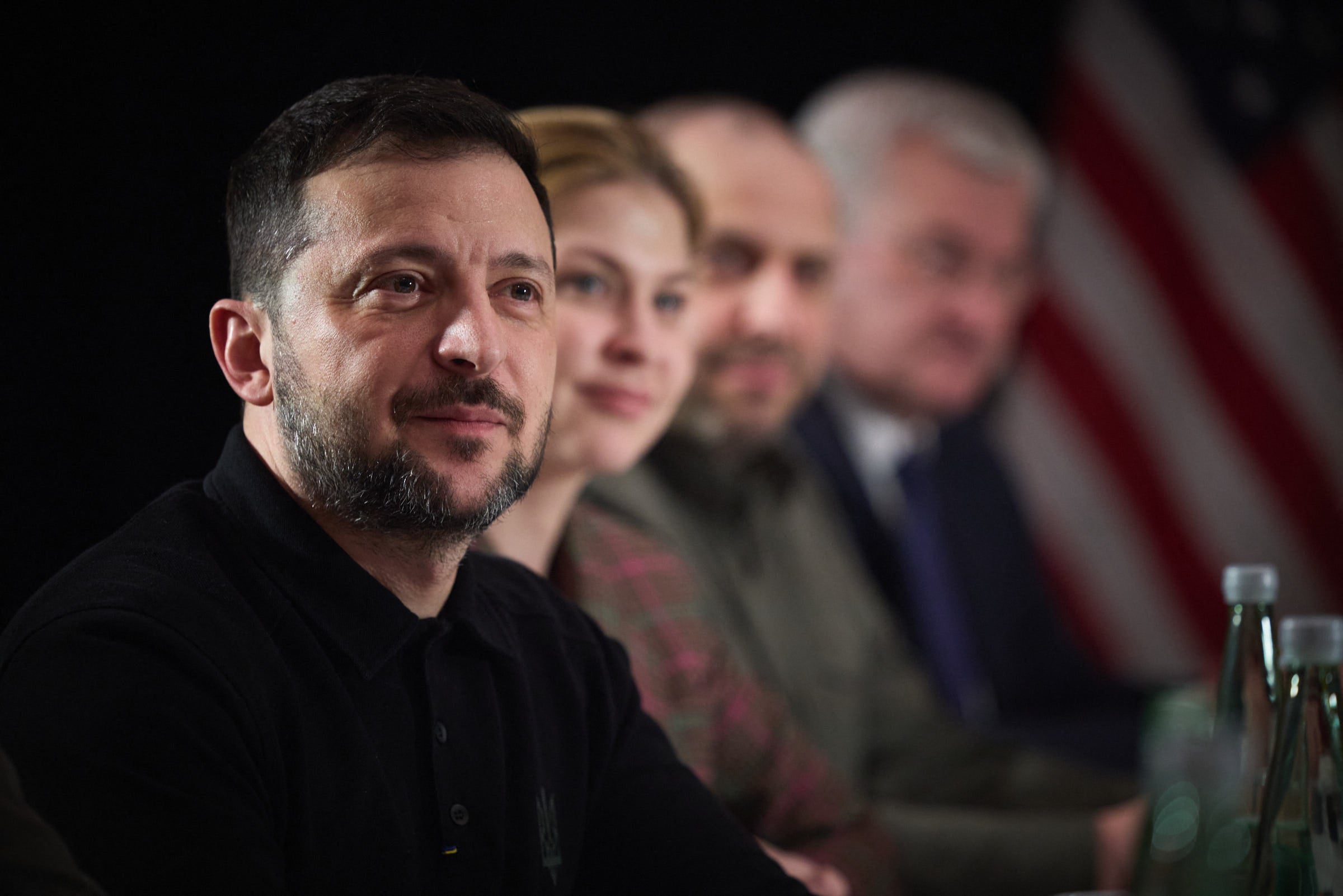 Volodymyr Zelensky listening to Vice President JD Vance during their talks on the sidelines of the Munich Security Conference