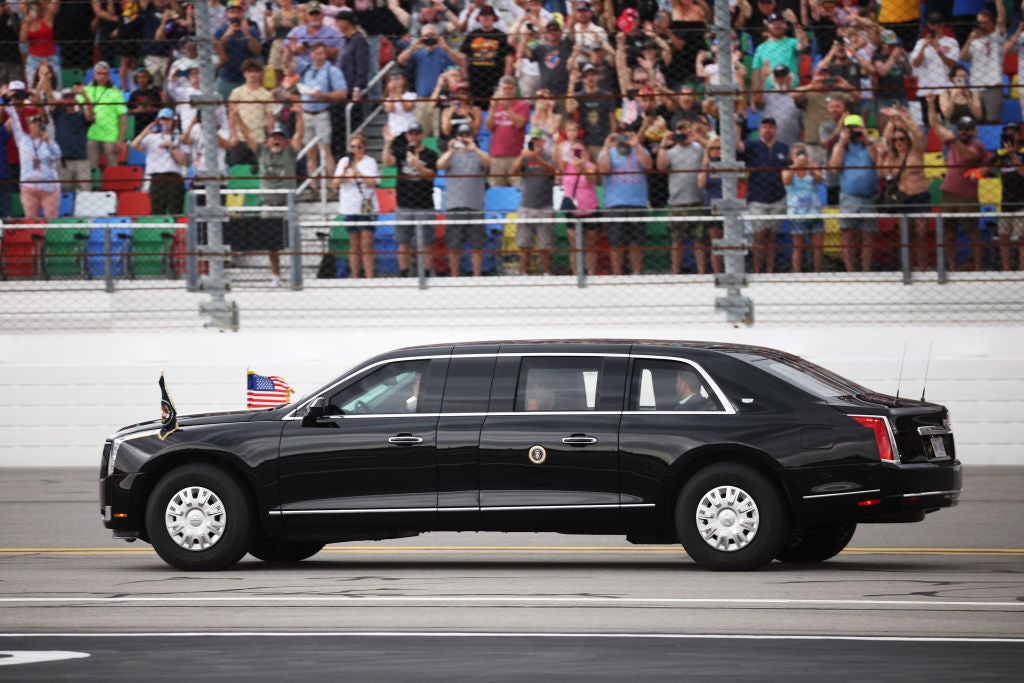 Donald Trump rode around the Daytona 500 track in “the Beast” followed by his motorcade on February 16