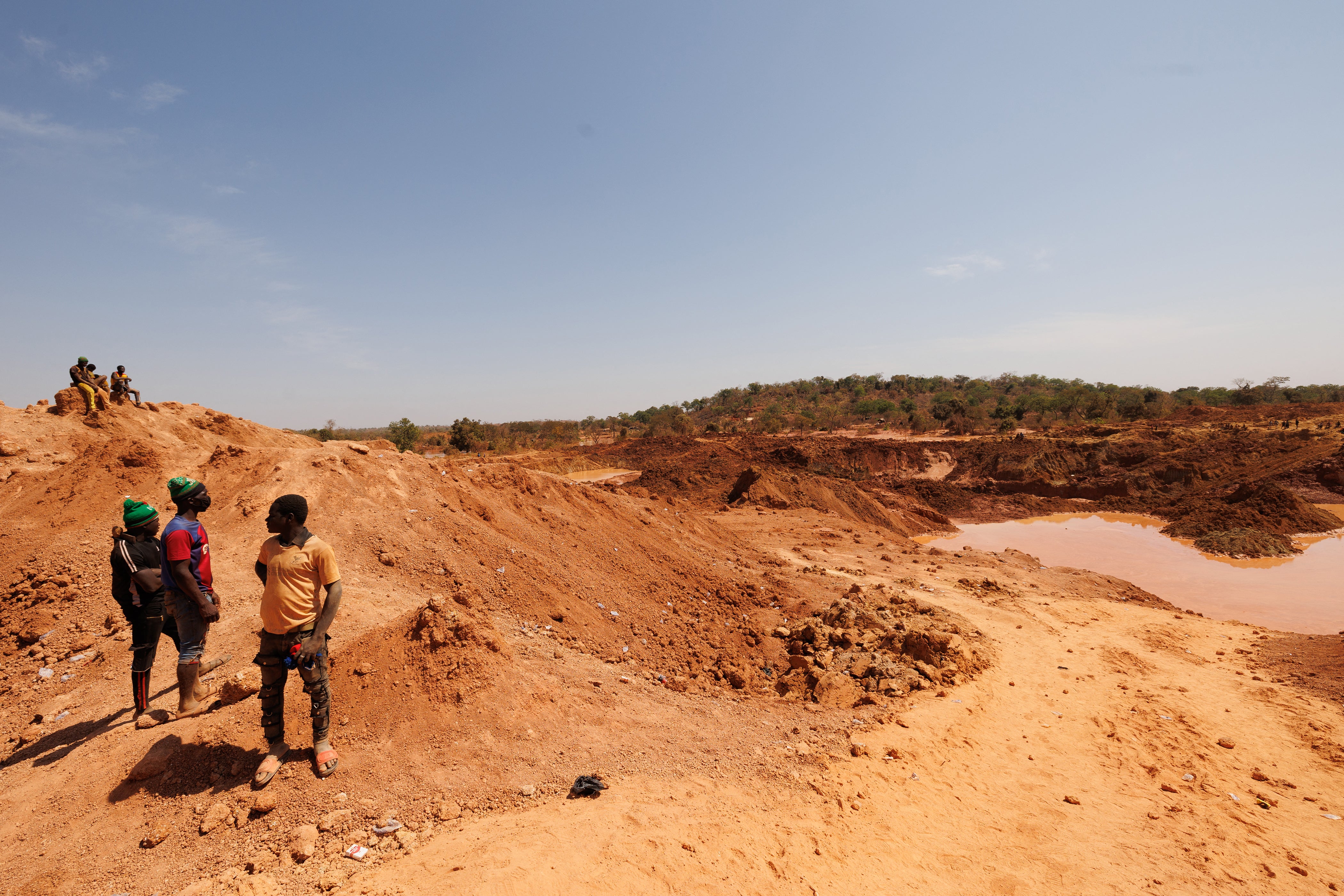 <p>File. People look at an artisanal goldmine in Danga, Mali, after a landslide killed at least 10 people in January</p>
