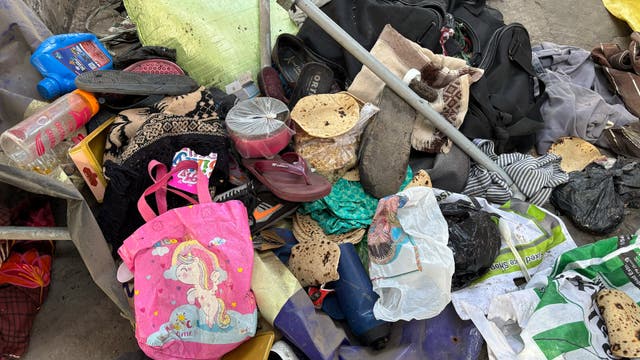 <p>Passengers belongings lie at India railway station as stampede kills 18</p>
