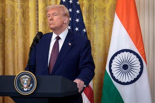 US president Donald Trump listens during a press conference on 13 February 2025