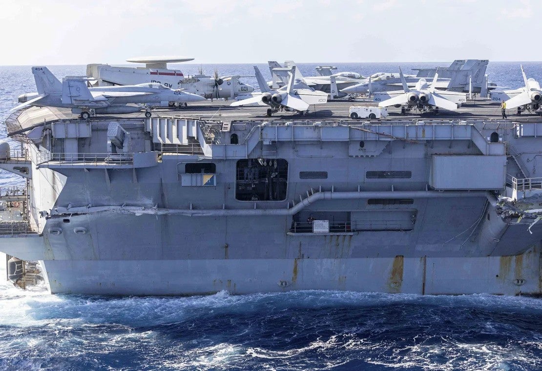 The damaged USS Harry S. Truman pulled into a facility in Souda Bay, Greece, for emergency repairs on Sunday