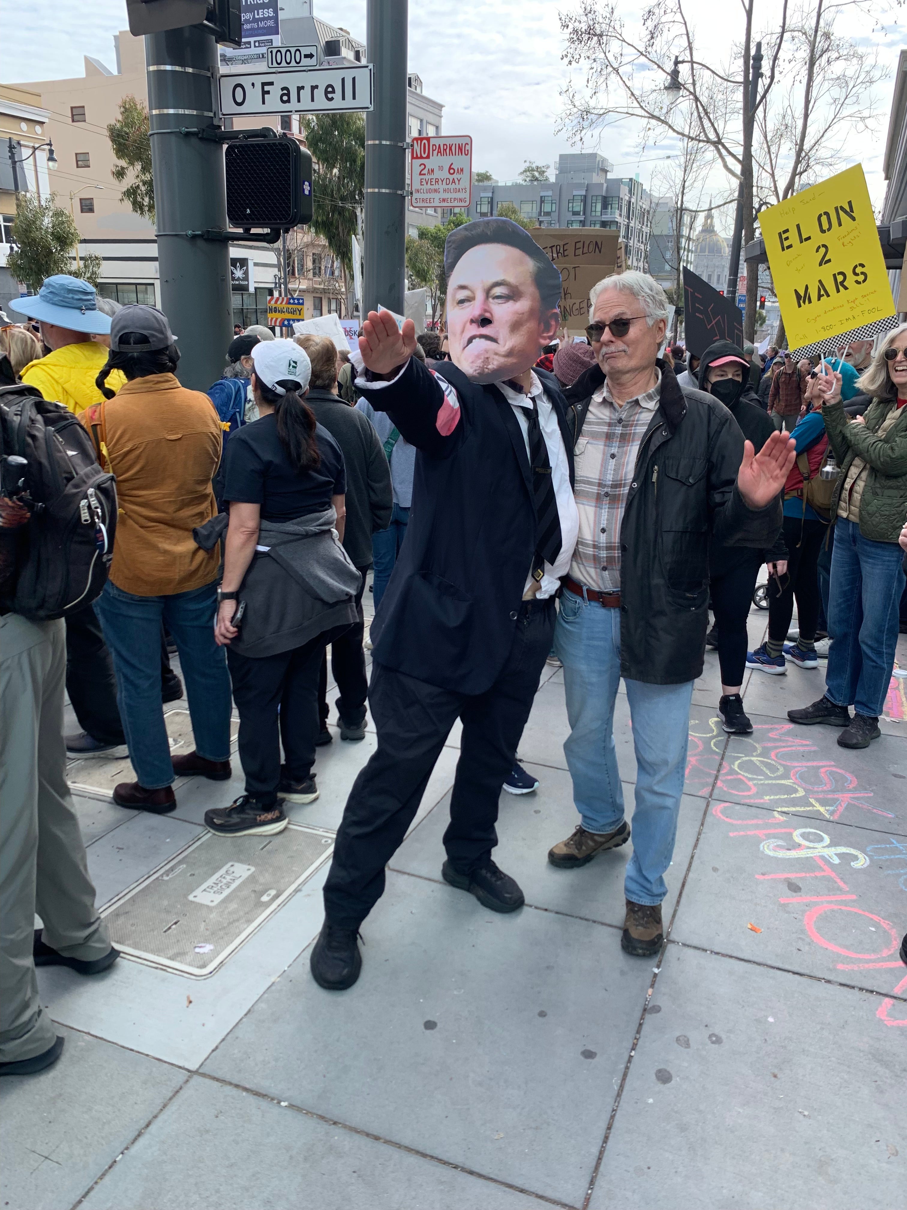 Protester in Elon Musk mask flashes a ‘sieg heil’ Nazi salute in front of a Tesla showroom in San Francisco