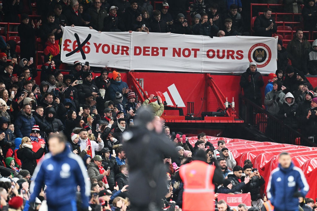 Man Utd fans display a banner in protest of the removal of concession pricing at Old Trafford