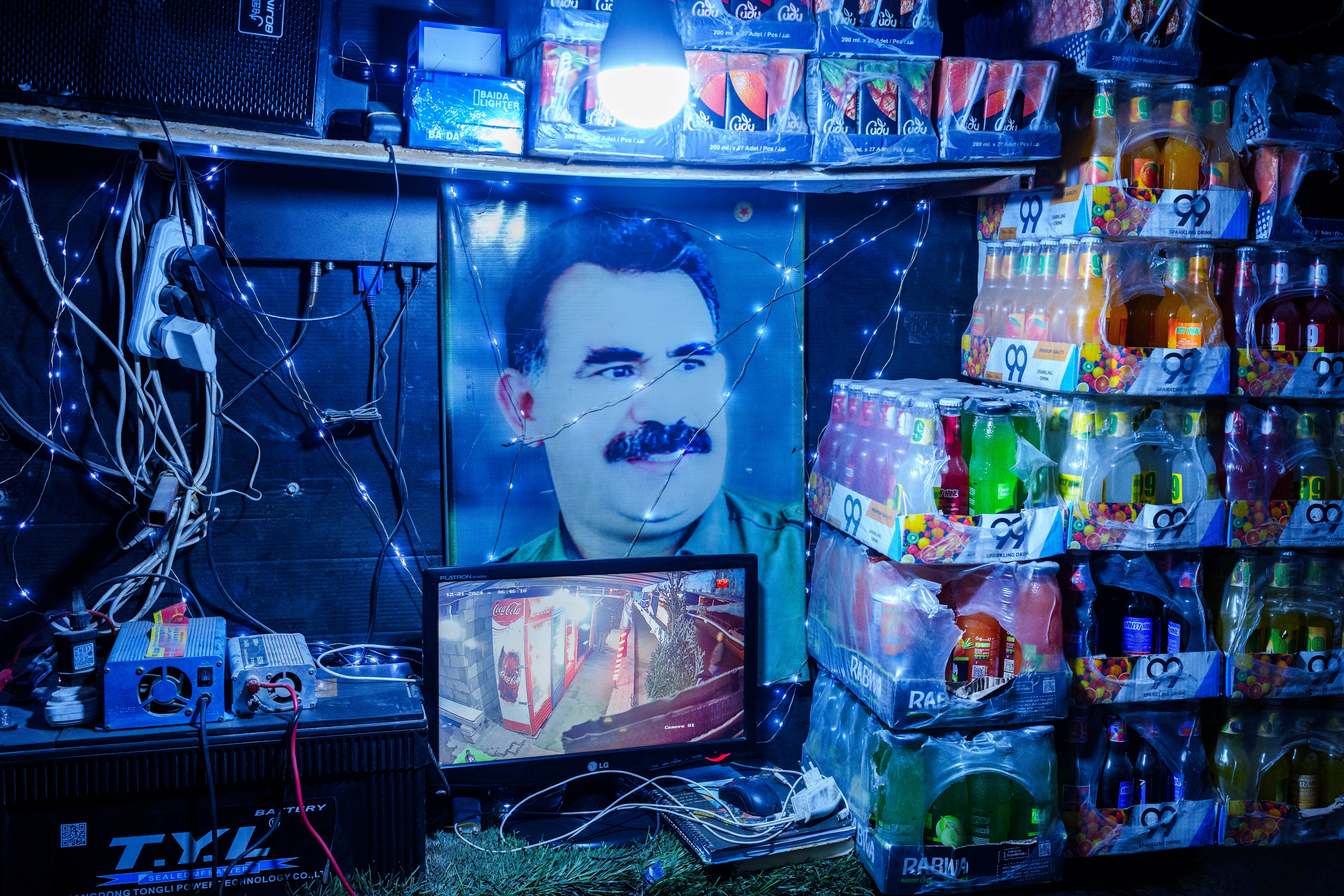 A picture of Abdullah Ocalan, the imprisoned leader of Turkey's banned Kurdistan Workers' Party, or PKK, is displayed inside a shop in the northern Syrian city of Qamishli