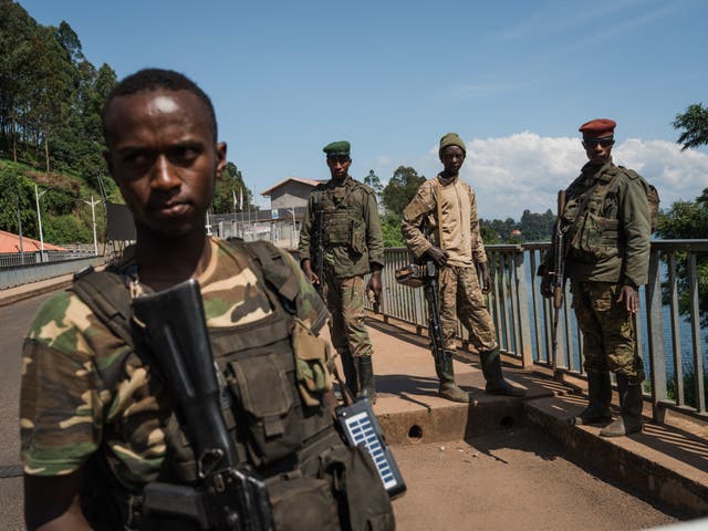 <p>M23 rebel troops arrive at the Rusizi border post, joining the Congolese city of Bukavu with Cyangugu in Rwanda, on February 16</p>