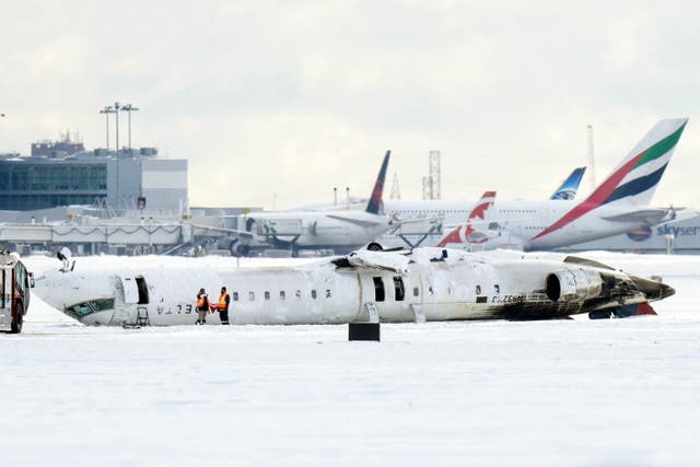 <p>A Delta Air Lines plane lies upside down at Toronto Pearson Airport on Tuesday, Feb. 18, 2025</p>