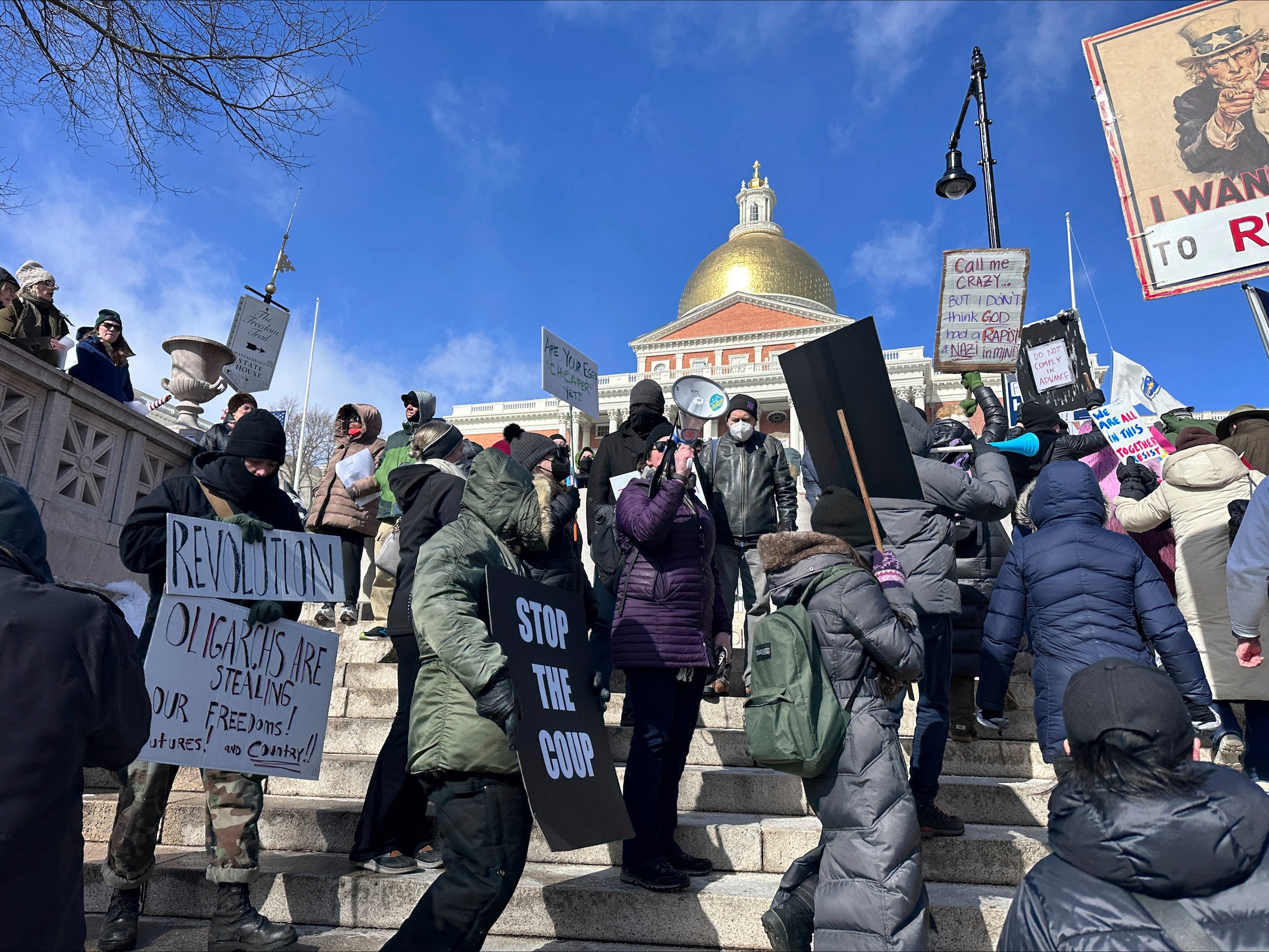 More than 1,000 protesters gather at the State House in Boston to protest against Donald Trump and Elon Musk