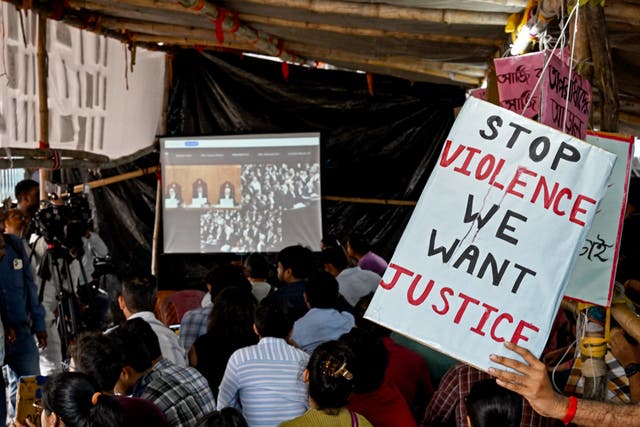 <p>Representative: Students hold posters protesting violence against women in India</p>