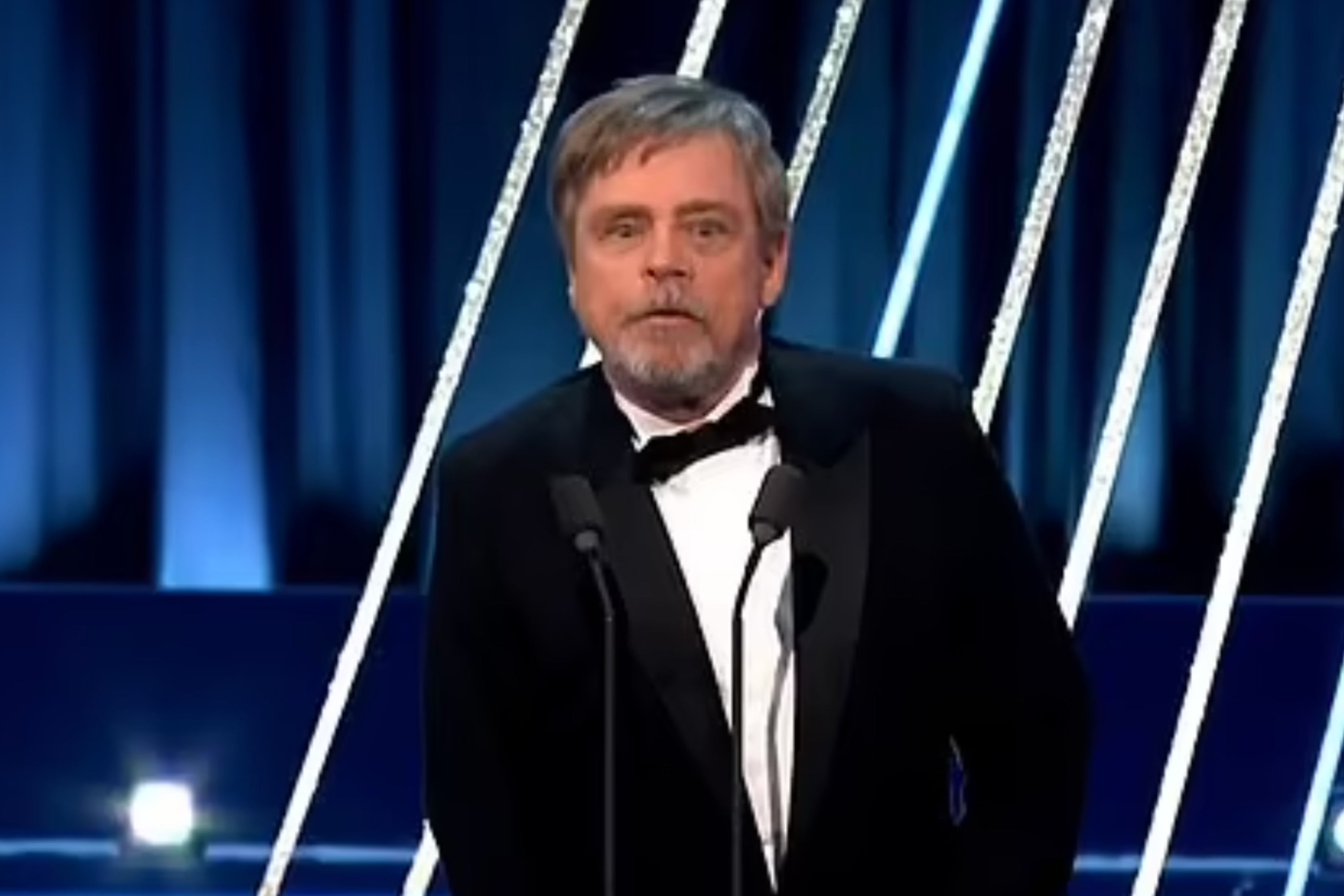 Mark Hamill readjusts his trousers after an embarrassing moment at the Baftas