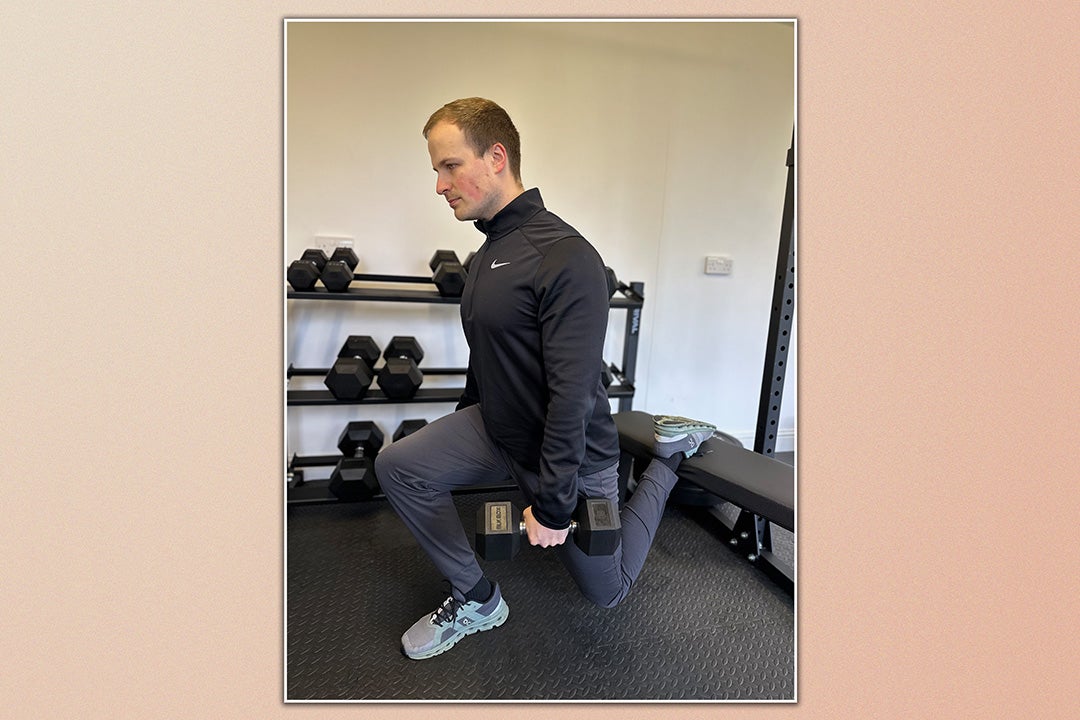 Personal trainer Ollie Thompson demonstrating a Bulgarian split squat