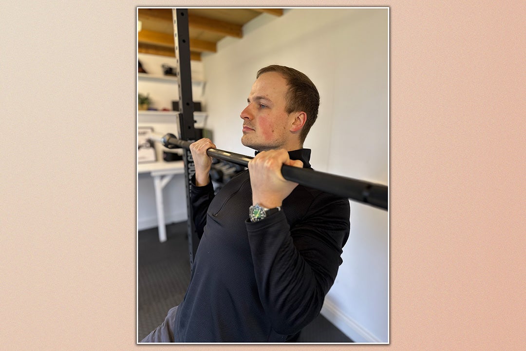 Personal trainer Ollie thompson demonstrating an assisted chin-up