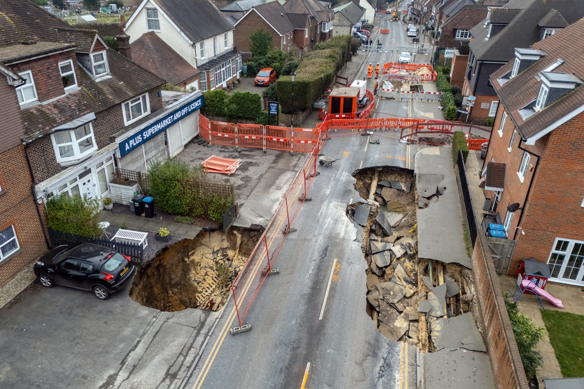 Second sinkhole opens in Surrey village as residents left unable to return home Second sinkhole opens in Surrey village as residents left unable to return home