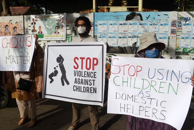 <p>File. Activists of Civil Society carry placards during a protest against child labour and violence against children, in Karachi on 8 June 2020</p>